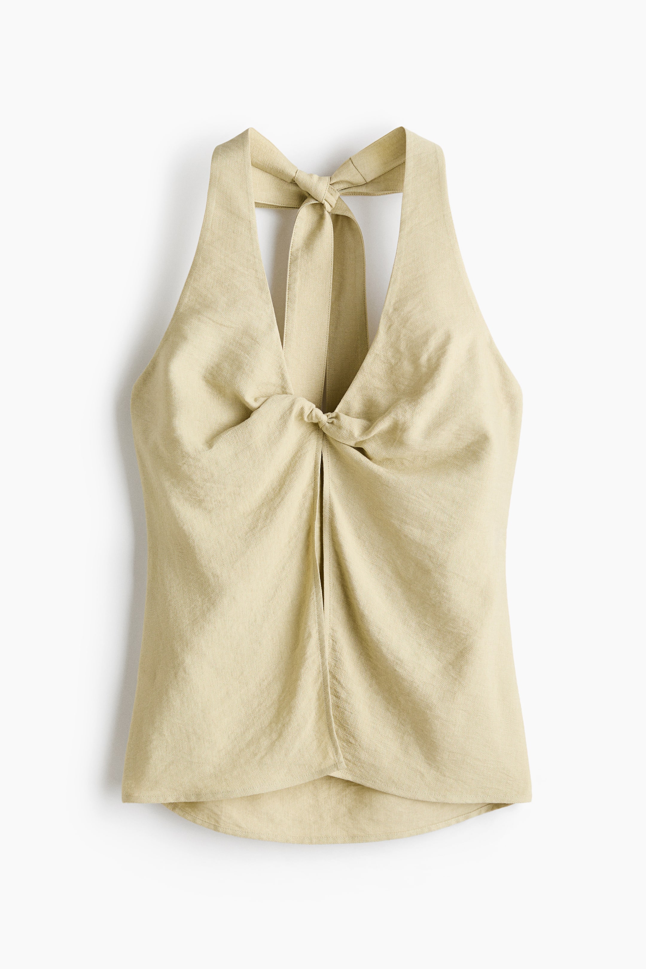 View larger image: Light beige halter-neck top, front-facing, crafted from a subtly textured fabric. It features a V-neckline with a knotted detail at the centre, creating gathering and a vertical slit beneath, while wide halter straps extend upwards to form a bow at the back of the neck.