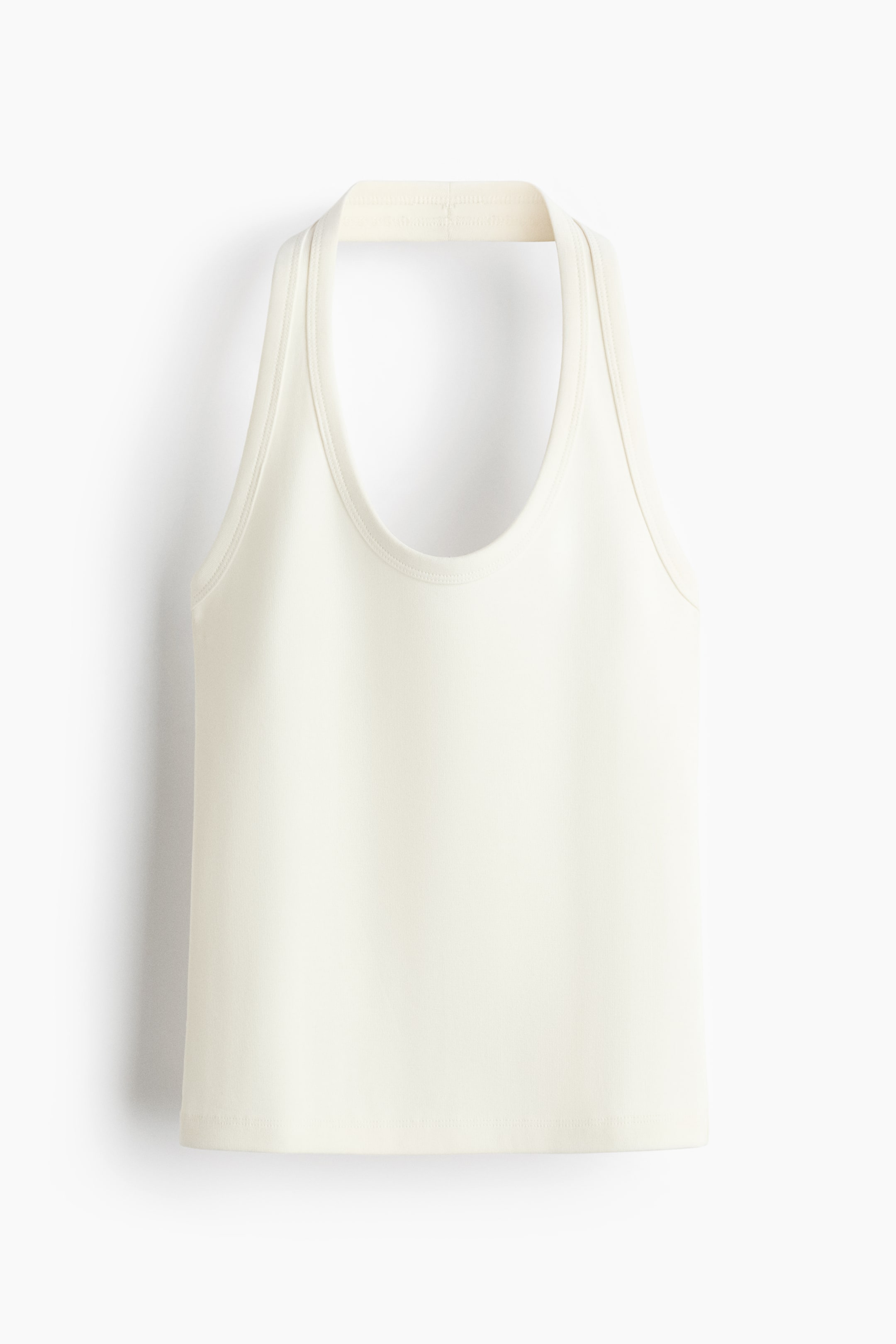 View larger image: "The cream-coloured tank top showcases its front with a broad halter neck band, a deep scoop neckline, and a sleek, sleeveless body finished with a straight hem."