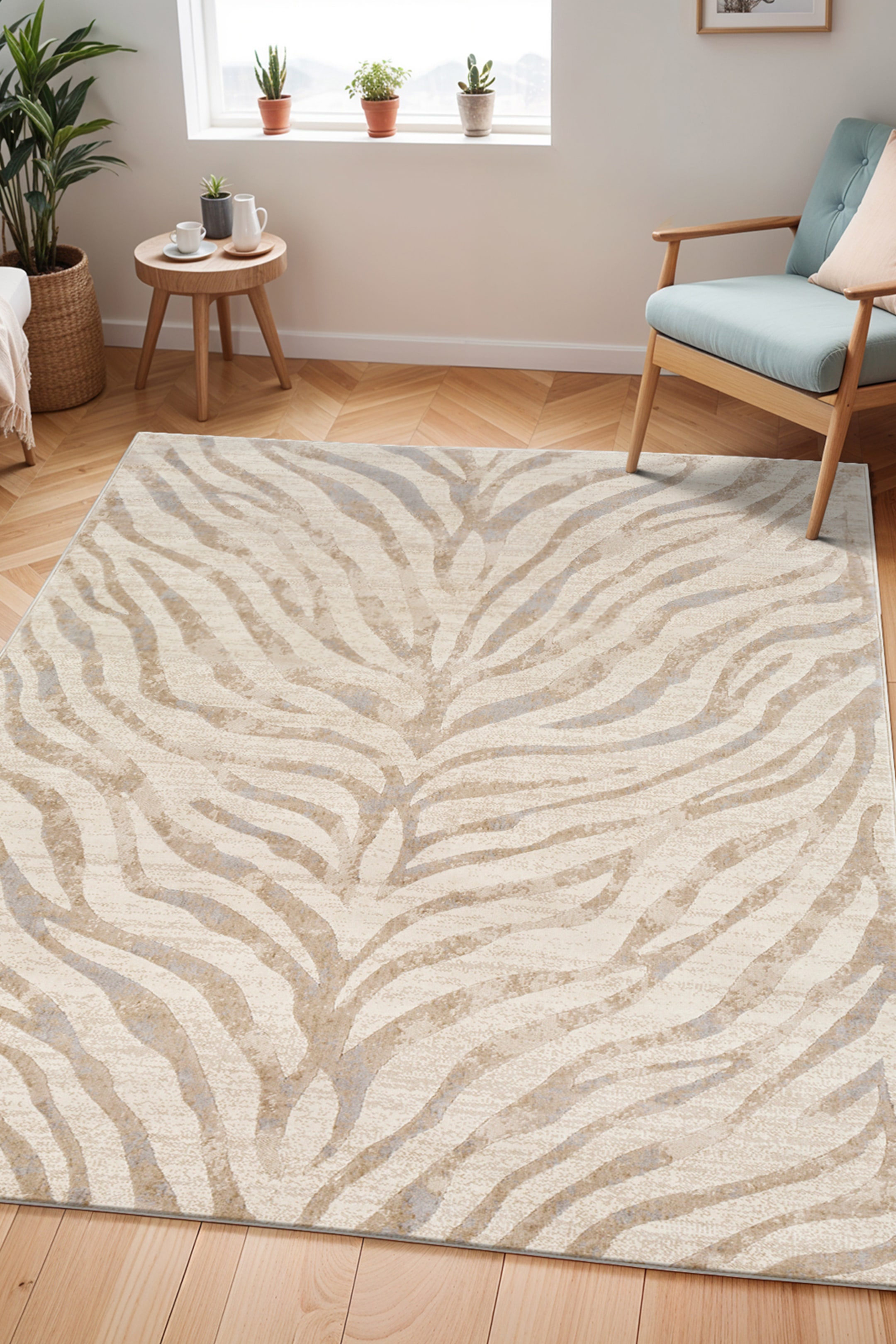 View larger image: A rectangular rug is laid flat, exhibiting an abstract pattern reminiscent of organic stripes in various shades of light brown and grey on a cream background. The pattern extends across the entire surface, with lines converging towards the centre, creating a dynamic visual flow.
