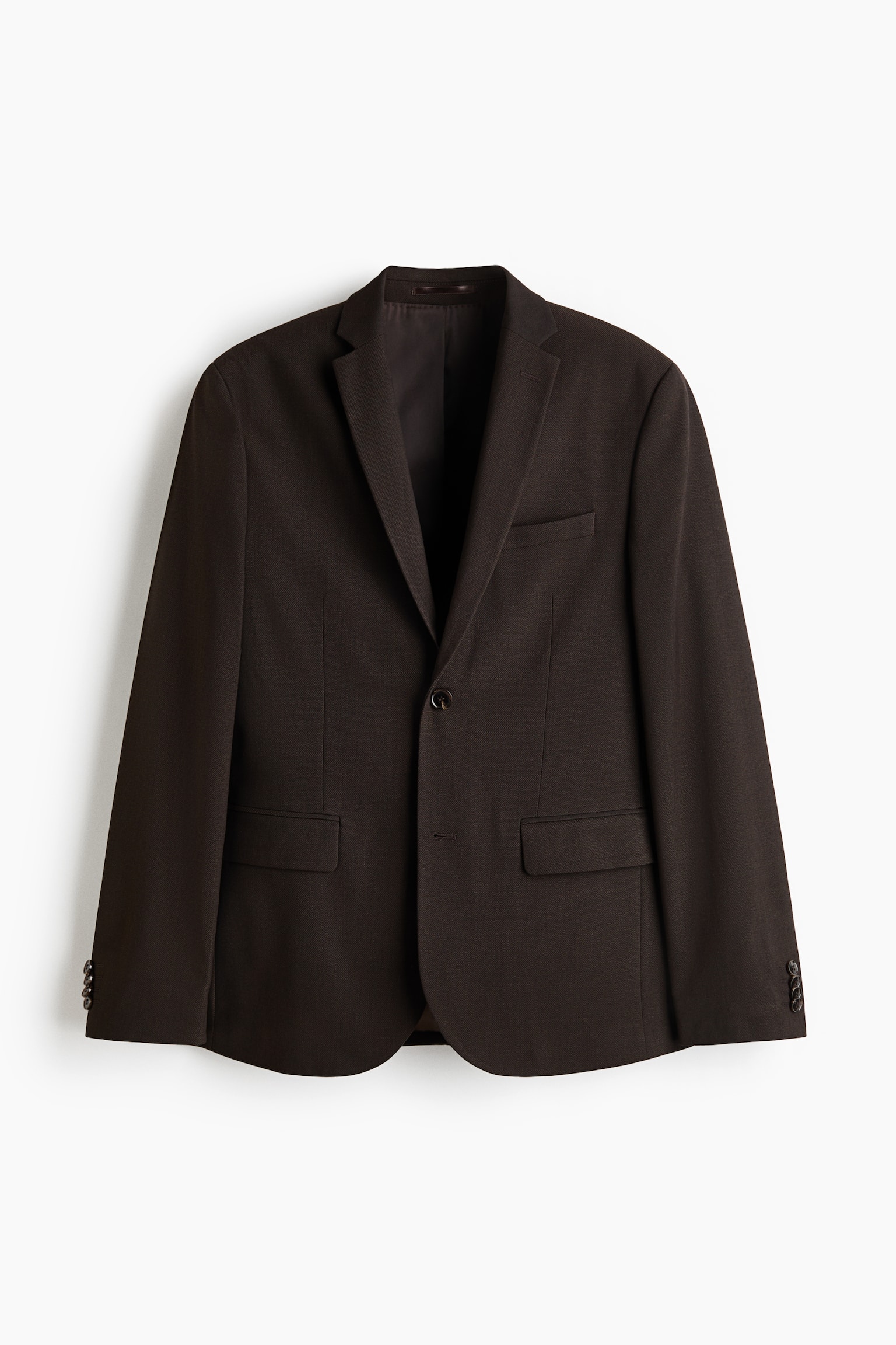 "A dark brown single-breasted jacket is being showcased from the front, highlighting narrow notch lapels with a decorative buttonhole, two front buttons, a welt chest pocket, two flap front pockets, and decorative buttons on the cuffs." - 1