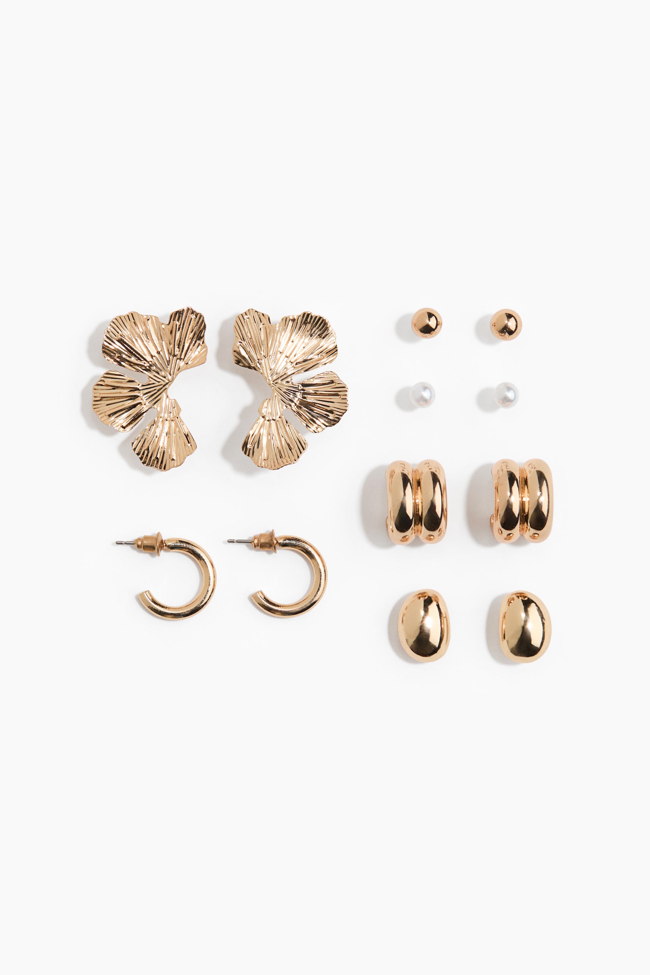 View larger image: A set of gold-toned earrings is presenting five distinct pairs, all facing front. 