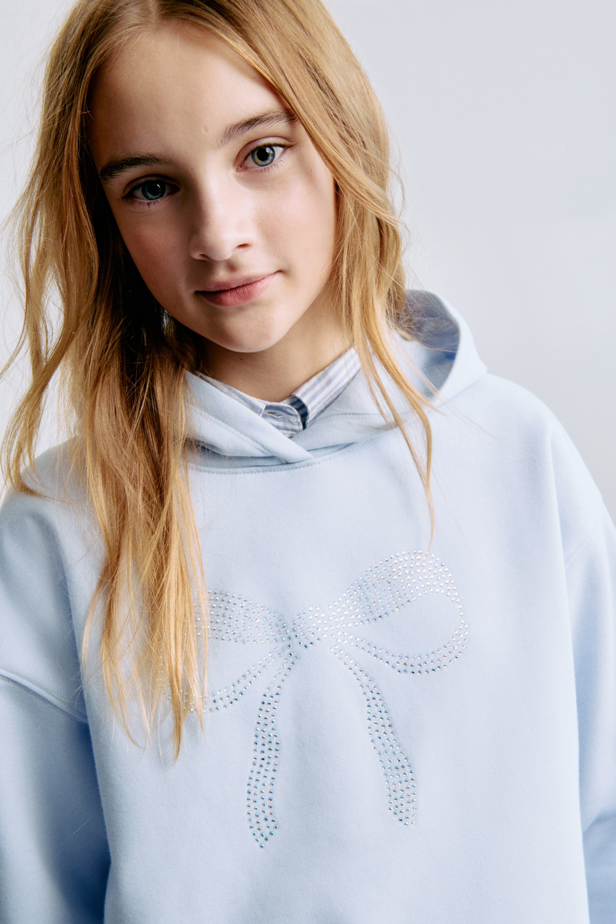 View larger image: Oversized motif-detail hoodie - Light blue/Bow - Kids | H&M IE 1
