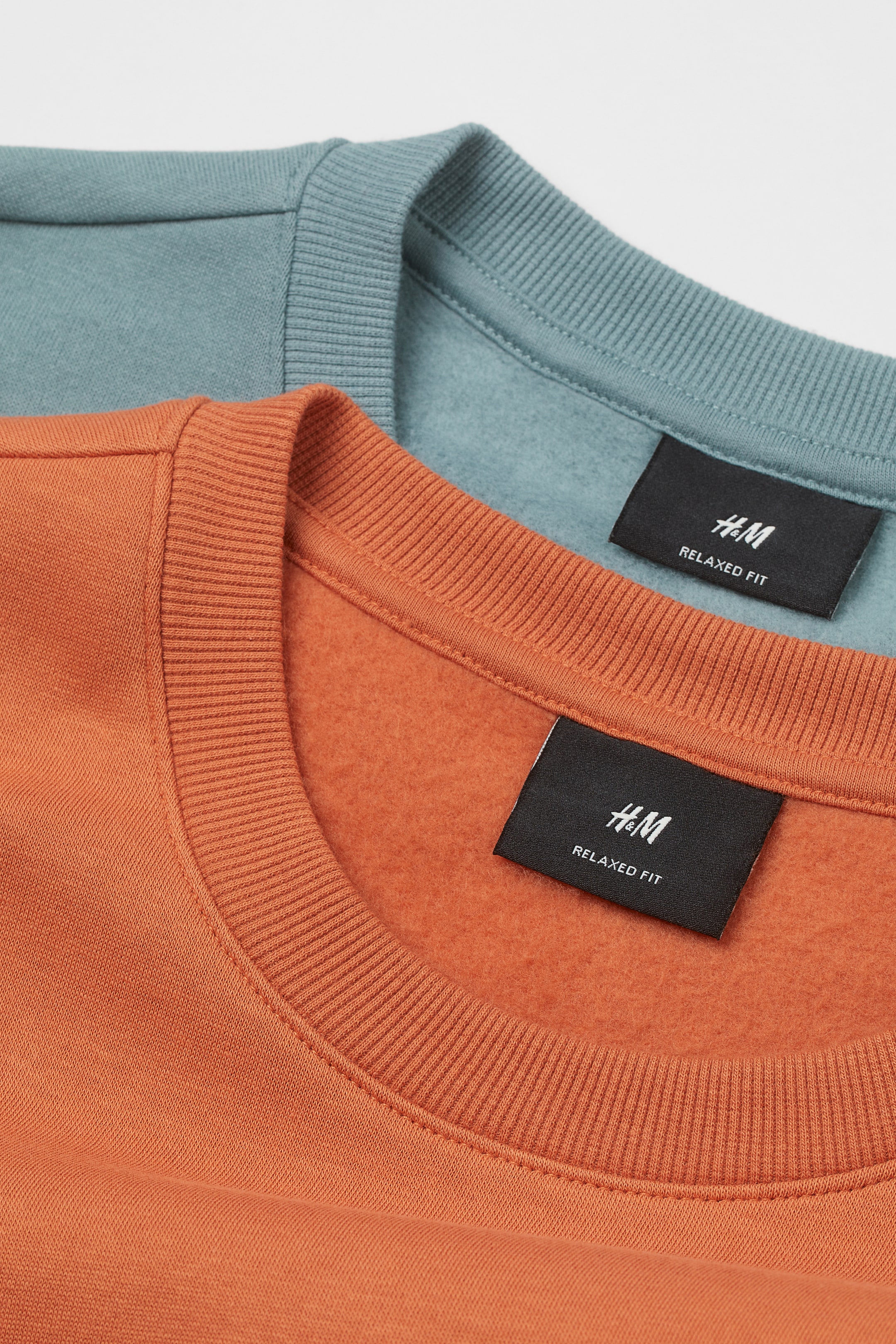 View larger image: 2-pack Loose Fit sweatshirts - Turquoise/Orange - Men | H&M IN 2