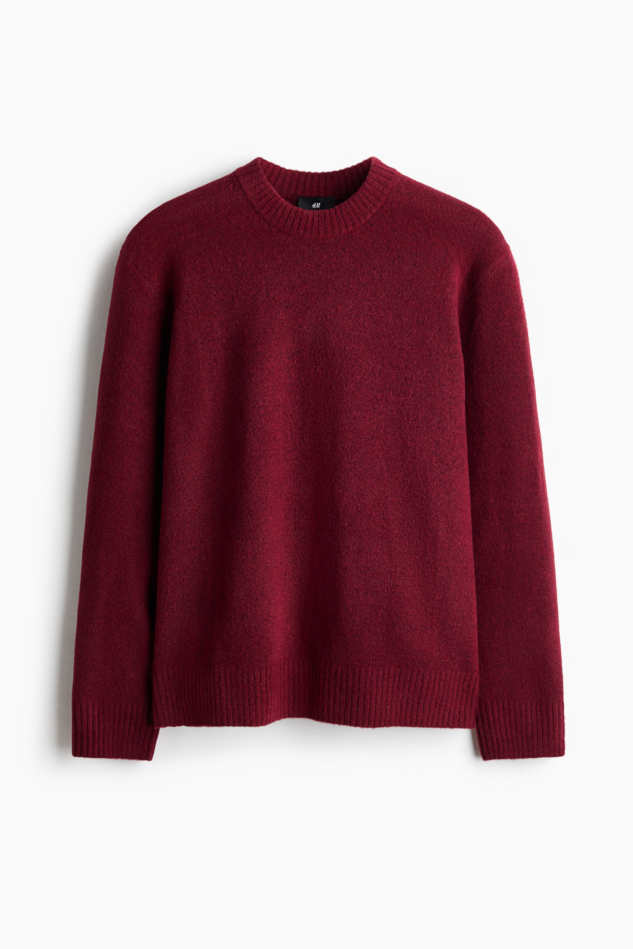 View larger image: This deep red regular-fit jumper features a soft knit with a brushed finish, a round rib-trimmed neckline, and ribbing at the cuffs and hem, shown from the front.