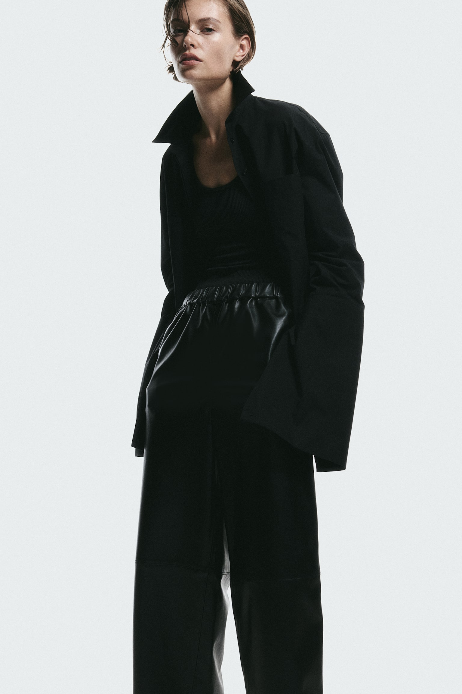 Coated trousers - Black - 1