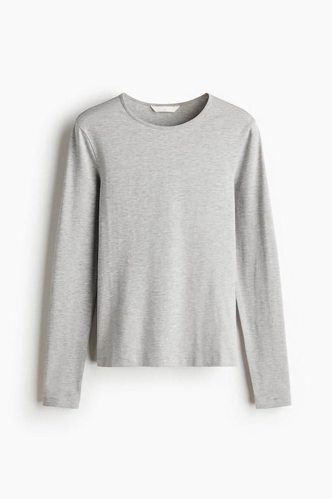 A light grey cotton jersey top is facing front, showcasing a round neckline, long sleeves, and a straight hem. - 1