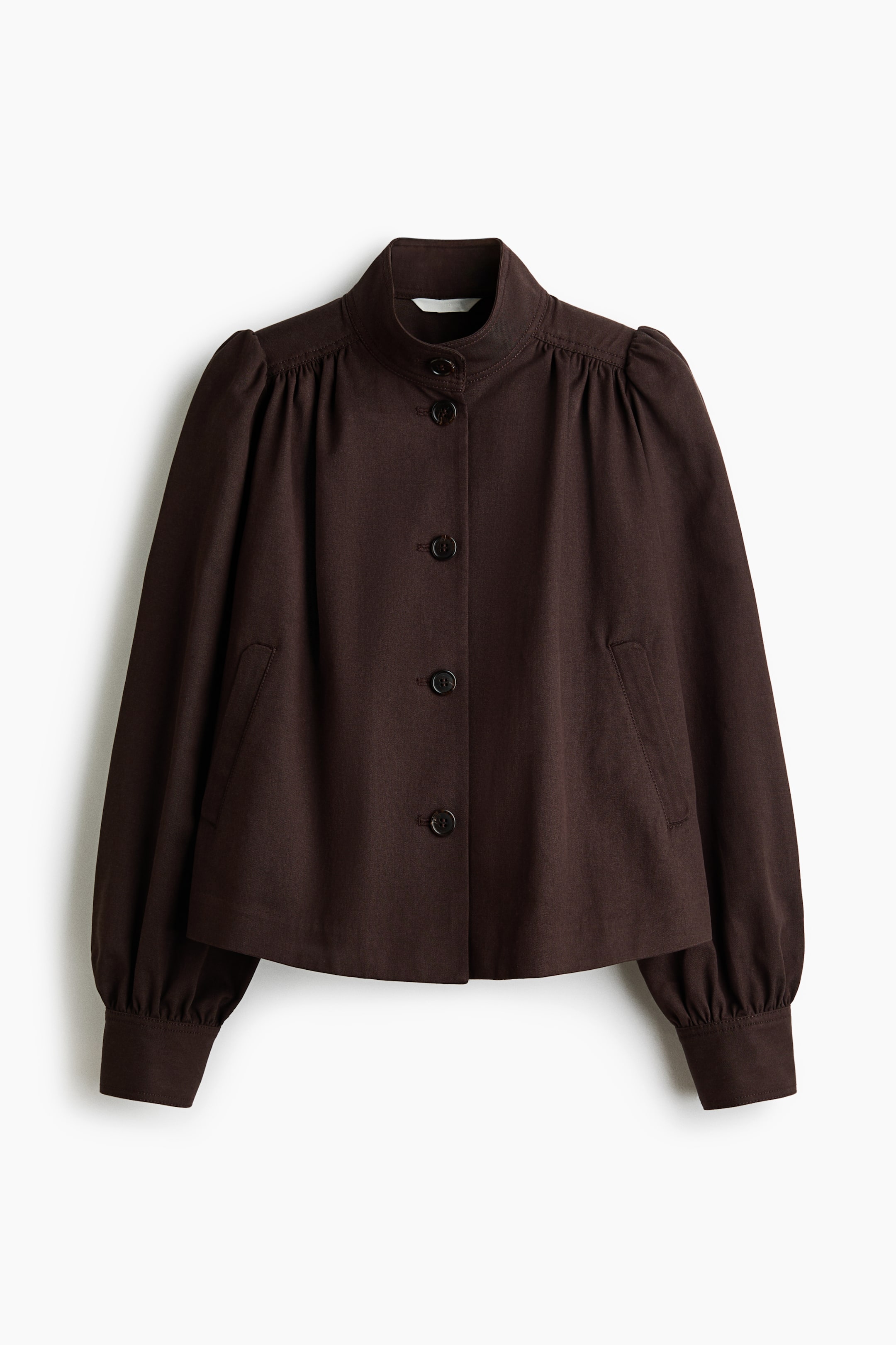 View larger image: A dark brown jacket shown from the front, featuring a stand-up collar and a button-front closure with five dark buttons. It has long puffed sleeves with gathering at the shoulders and buttoned cuffs, and two front slit pockets. The jacket is cropped.