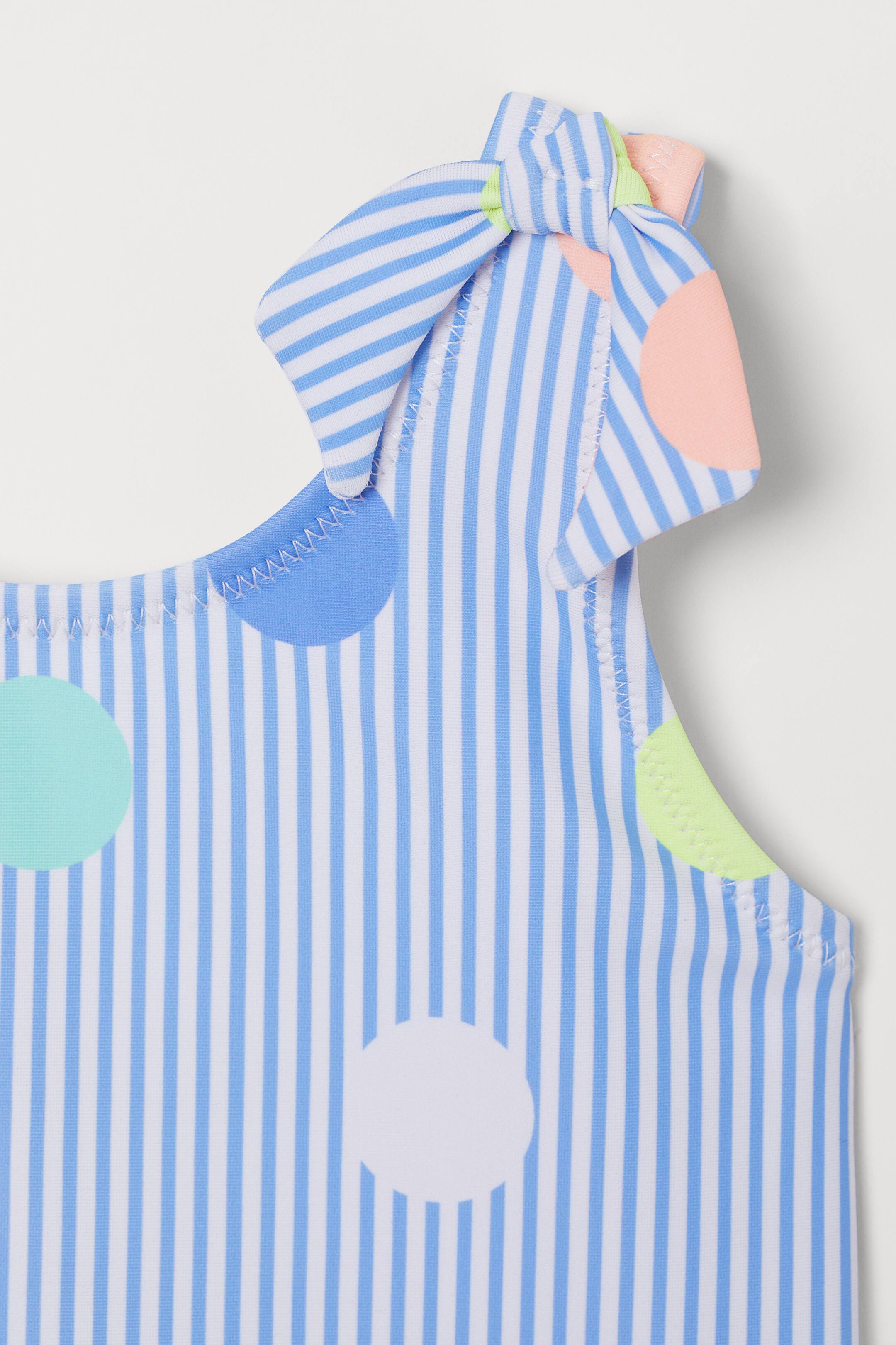 Bow-detail swimsuit - Light blue/Spotted - Kids | H&M GB