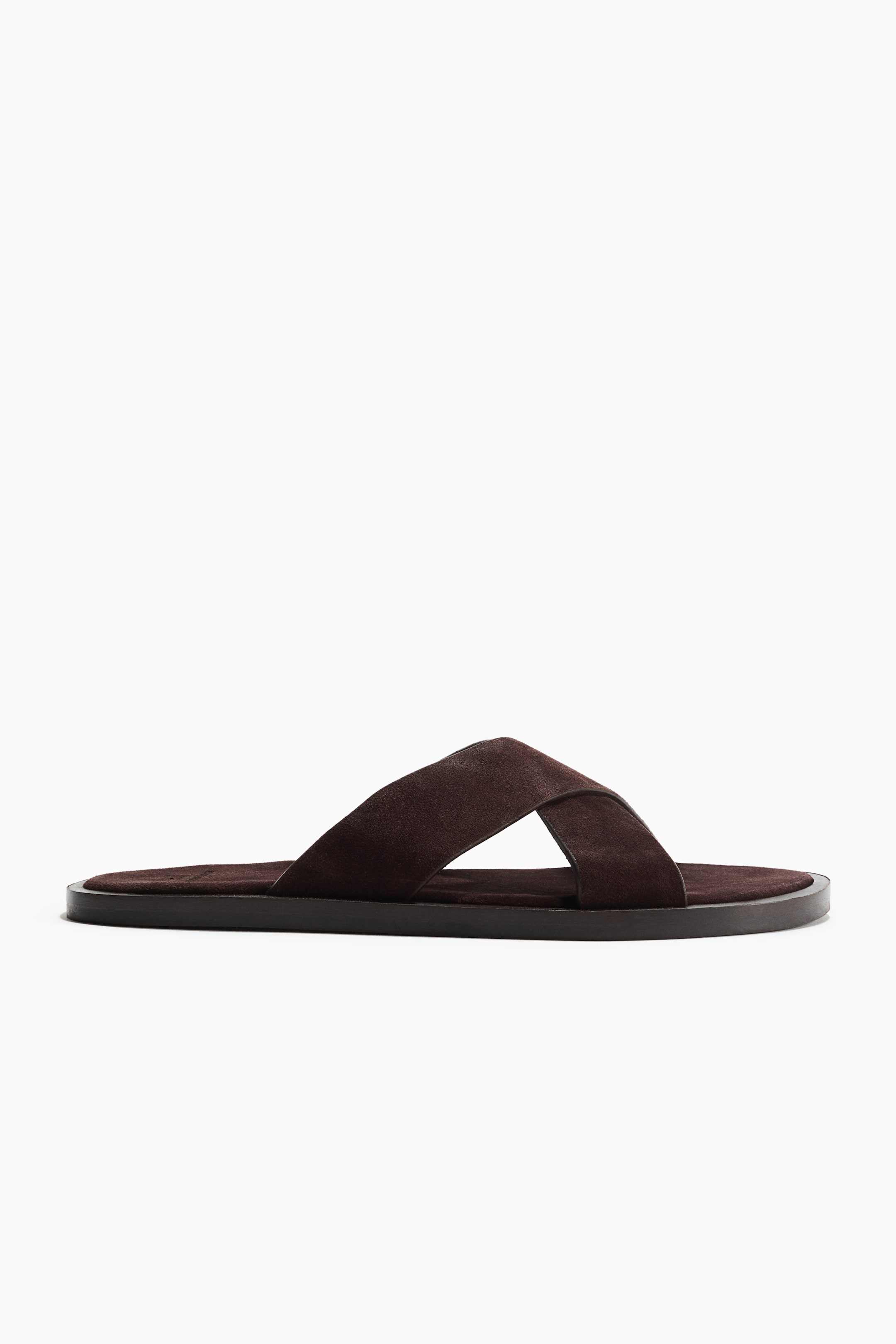 View larger image: A dark brown suede sandal featuring crossover straps at the front.