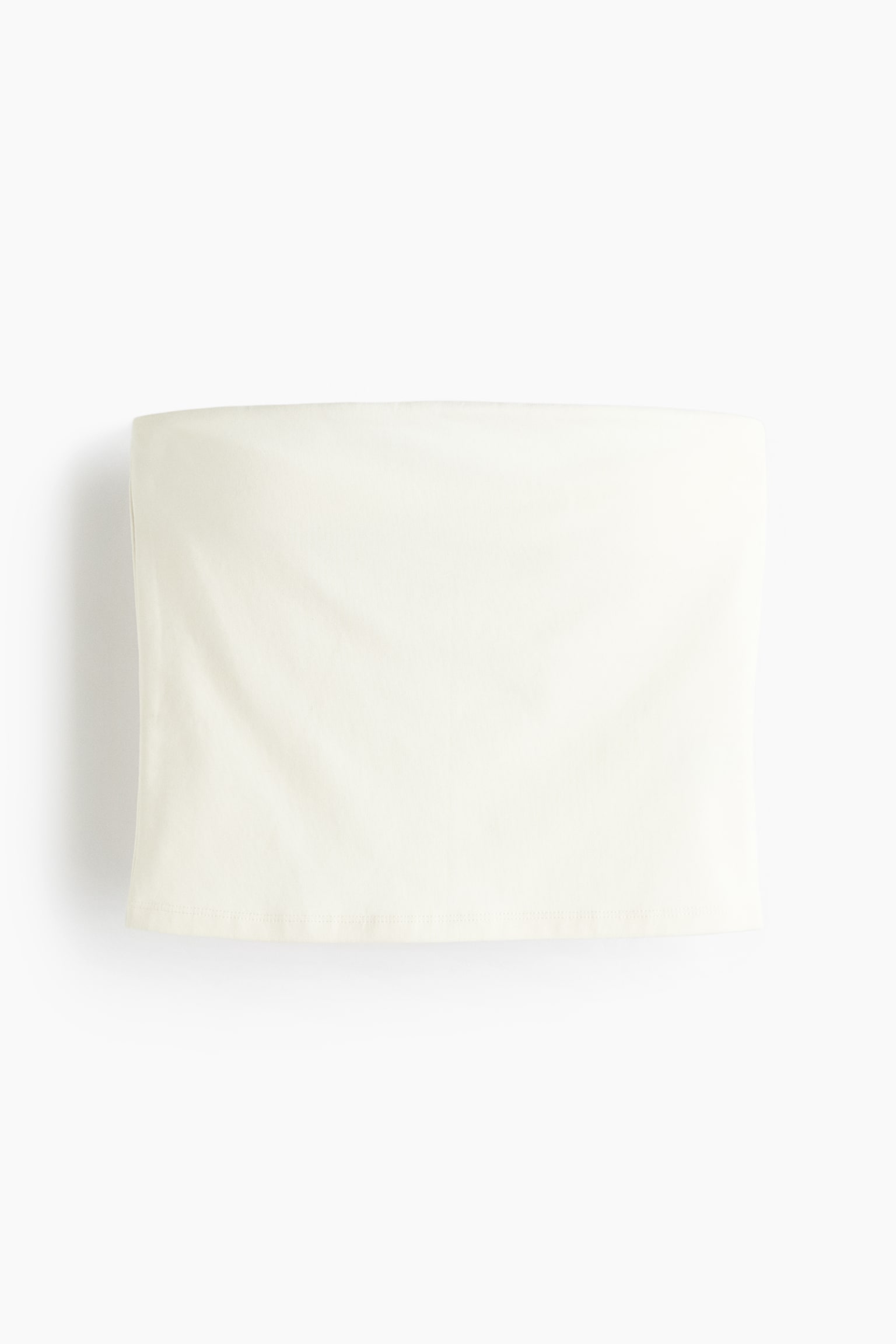A cream strapless top is displayed from the front, showing a straight neckline and a straight hem. - 1