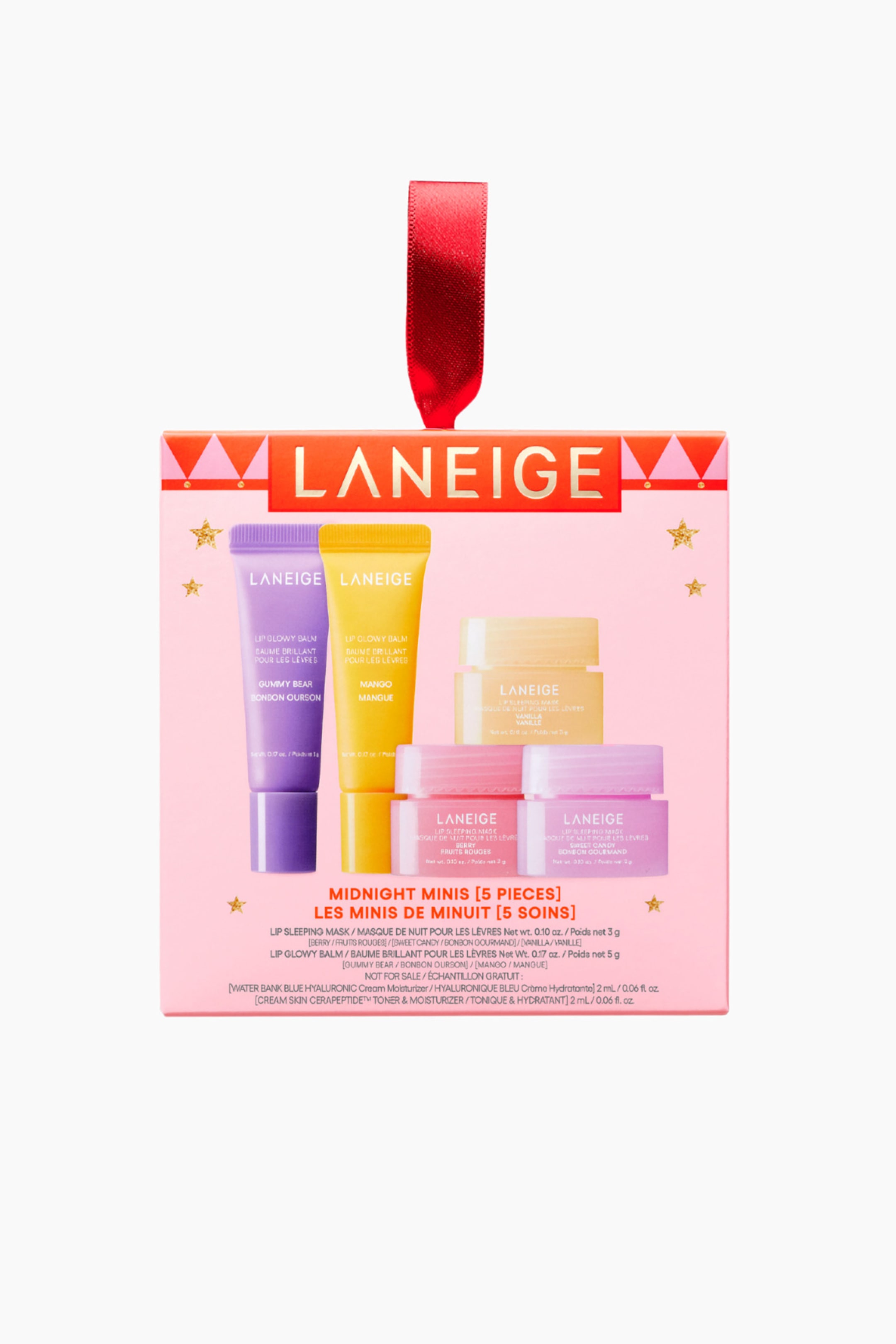 Visa större bild: Ett Laneige Midnight Minis 5-delars hudvårdsset presenterar en ljusrosa rektangulär låda, vänd framåt, med en orange överkant och ett rött band fäst. Lådan visar fem miniatyrprodukter: ett lila gummy bear lip glowy balm tube, ett gult mango lip glowy balm tube, en ljusgul vanilj läpp-sovmask-burk, en rosa bär läpp-sovmask-burk och en rosa sött godis läpp-sovmask-burk.