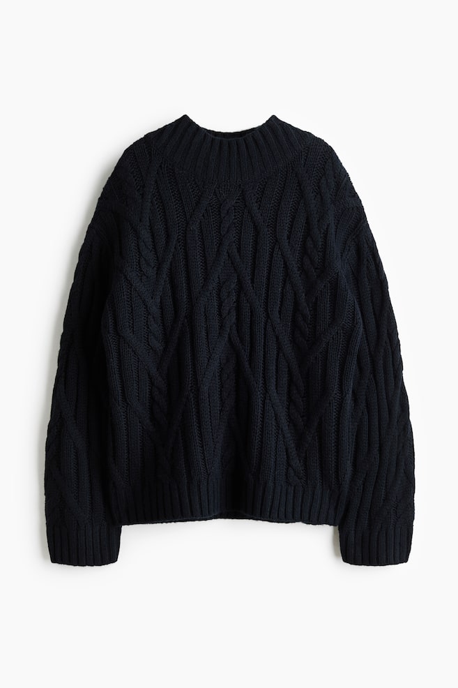 A dark navy blue cable-knit sweater is facing front, showcasing a chunky, all-over diamond cable pattern. It is featuring a thick ribbed mock neck, long sleeves with ribbed cuffs, and a matching ribbed hem. - 1