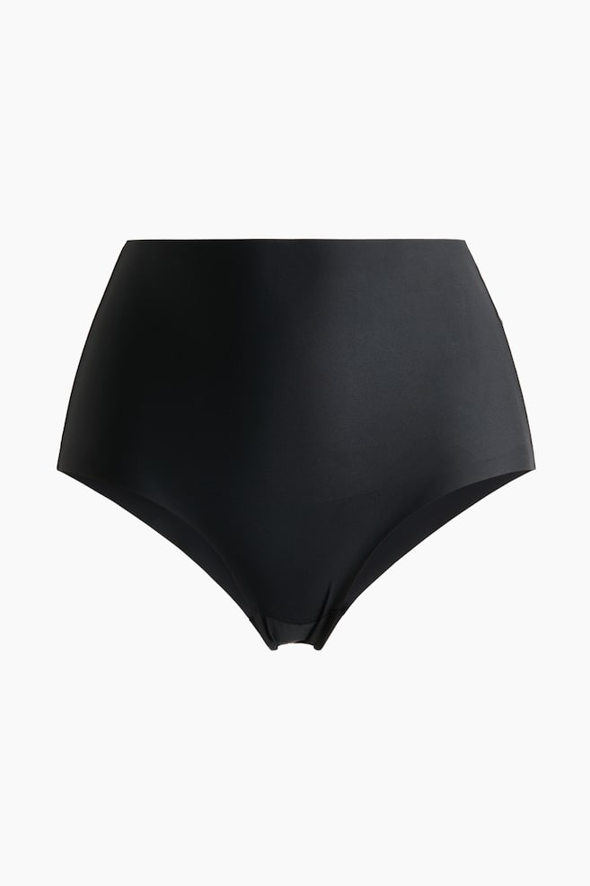 Black high-waisted briefs are facing front, displaying smooth microfibre fabric. Their edges are appearing laser-cut and seamless, and a lined gusset is visible at the crotch. - 1