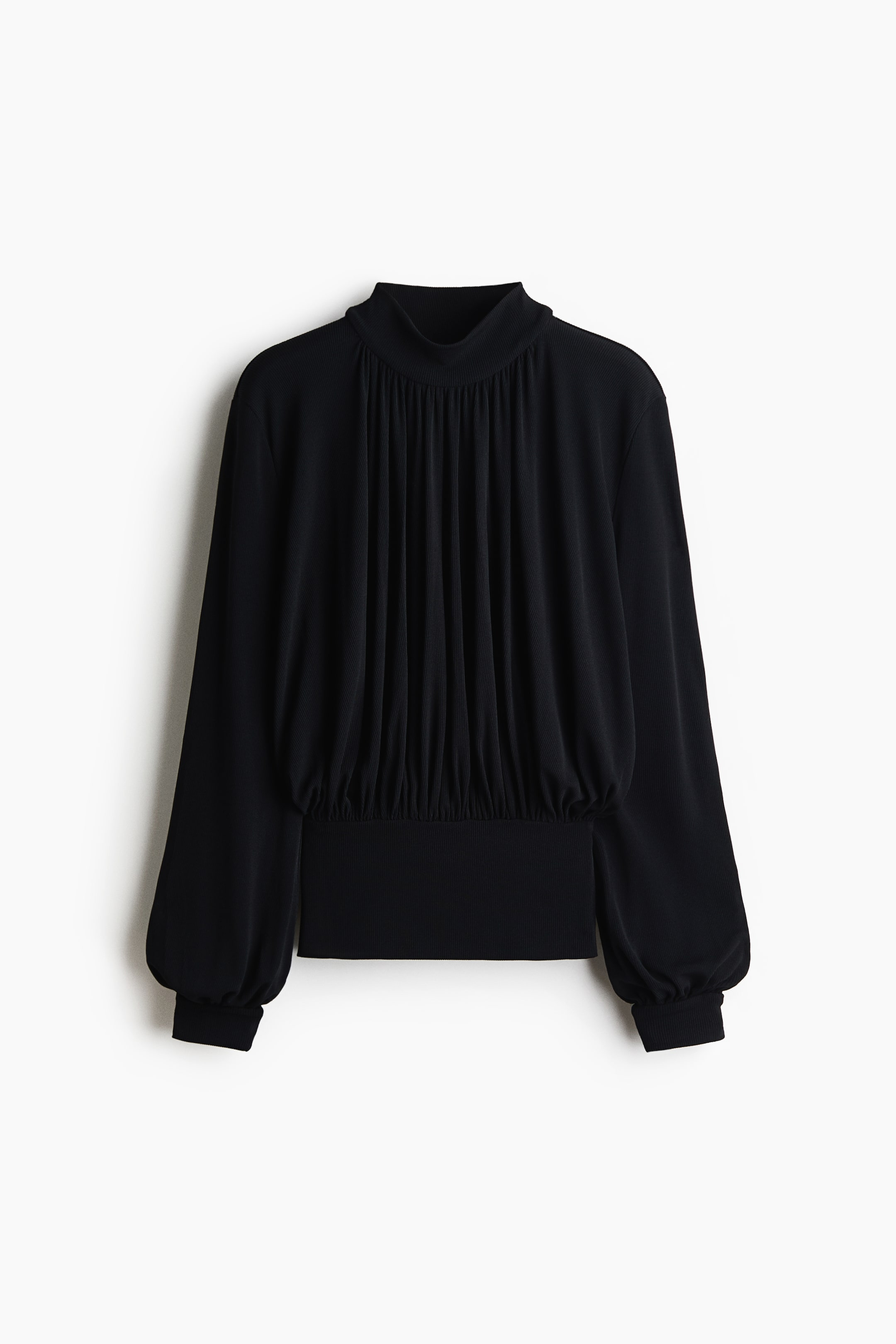View larger image: A black, loose-fit top in ribbed jersey is shown from the front, featuring a mock turtleneck with vertical gathers cascading down the front bodice. The design shows long balloon sleeves with ribbed cuffs and a wide, fitted waistband with gathers along the top edge.