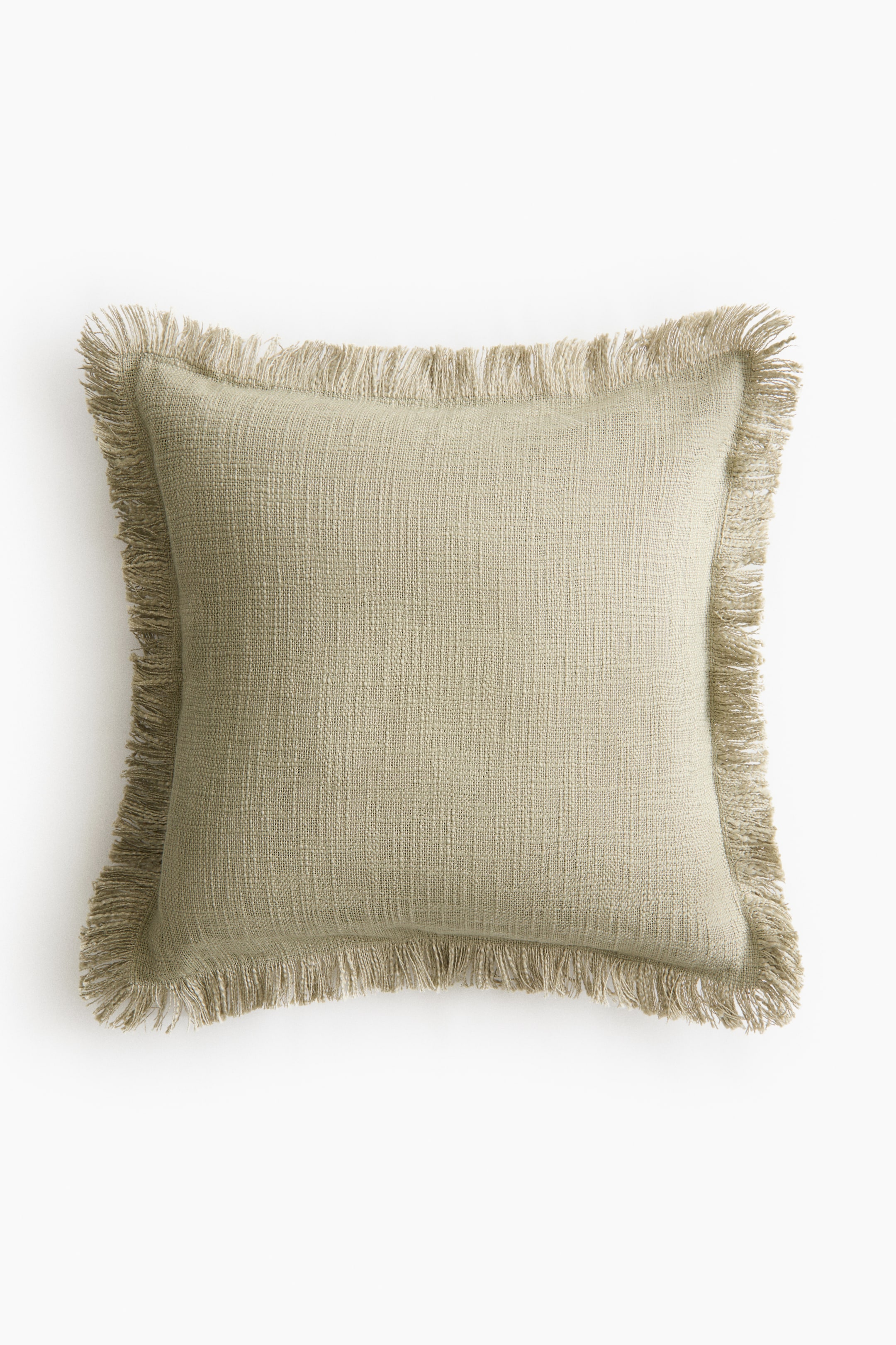 Voir une image plus grande: Une housse de coussin beige clair est présentée à L'AVANT, avec un tissage en slub texturé et des franges sur les quatre côtés.