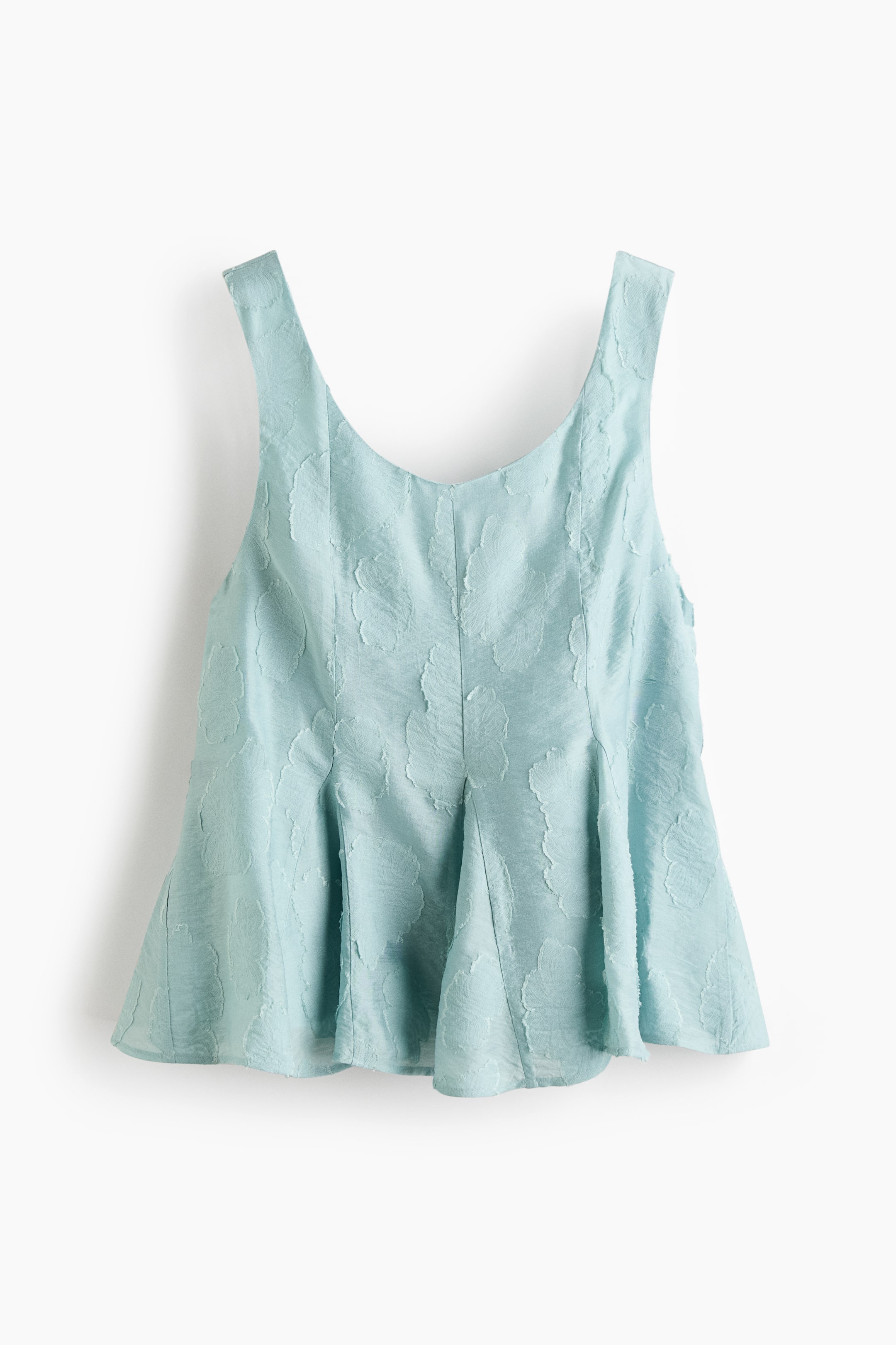 View larger image: A light blue sleeveless top showcases a textured, embossed pattern across its fabric, a V-neckline, and wide shoulder straps. The top gracefully flares into a peplum silhouette with pleats at the hem.