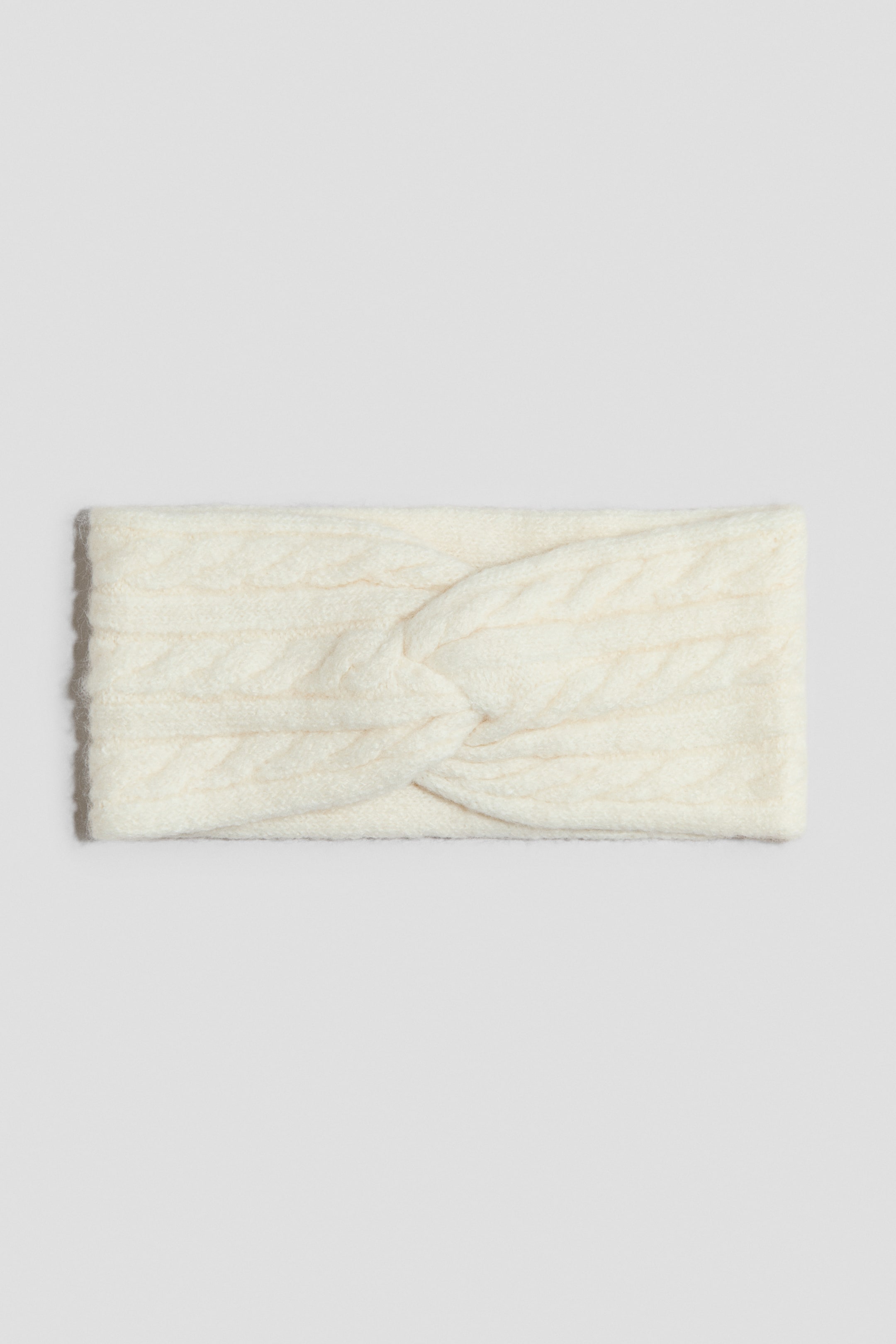 View larger image: A double-layer headband features a soft cable knit and a decorative twisted detail at the front.