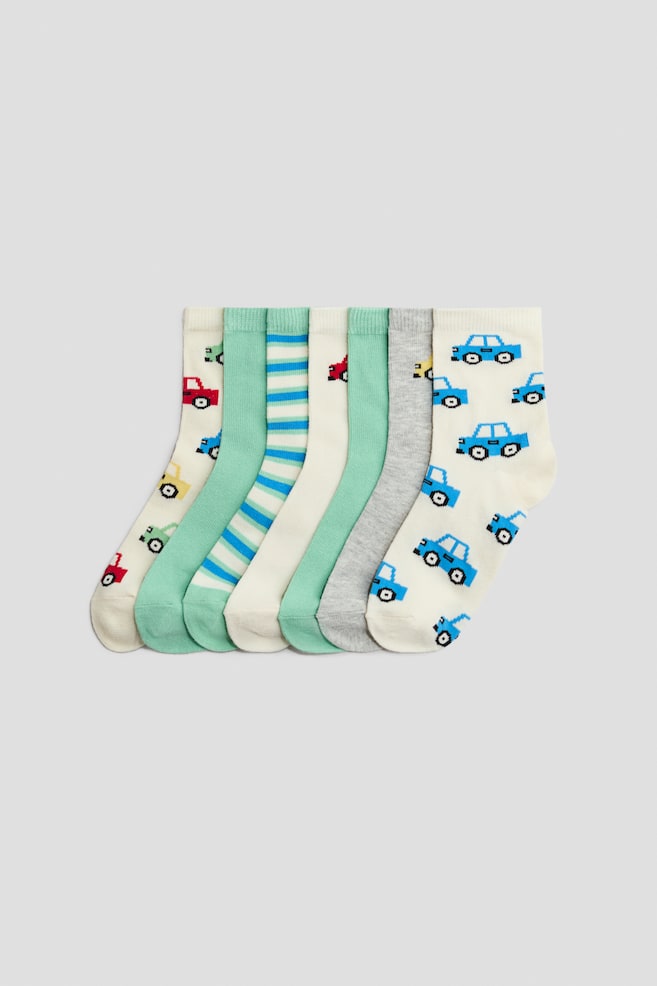 Set de 7 perechi de șosete - Verde/mașini/Bleumarin/zilele săptămânii/Verde-închis/mingi de sport/Bleumarin/dinozauri/Gri/mașini/Blue/Race Cars/Albastru-deschis/dinozaur/Albastru-închis/burgeri/Alb/teckel/Albastru/dinozauri/Alb/mâncare/Negru/Gaming/Gri-deschis melanj/vehicule/Verde/urși/Verde/tigri - 1