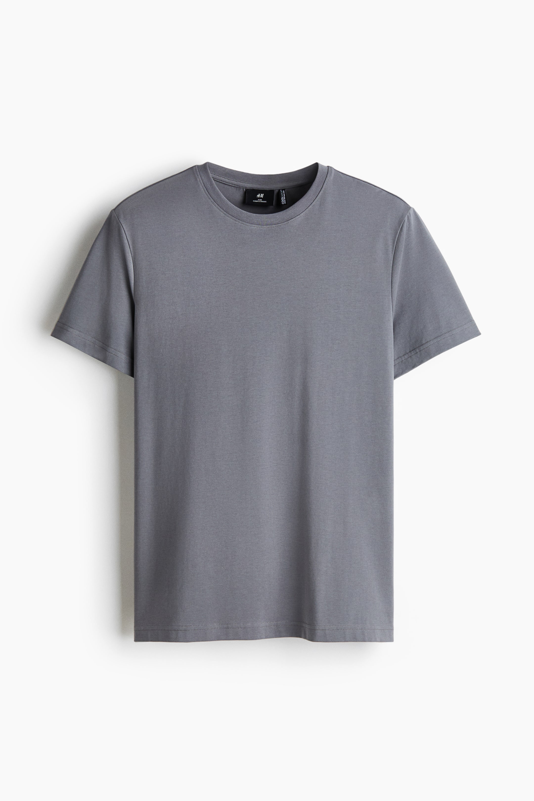 View larger image: A gray T-shirt is hanging, shown front-facing with a crew neck and short sleeves. A small H&M brand label is visible inside the back collar.