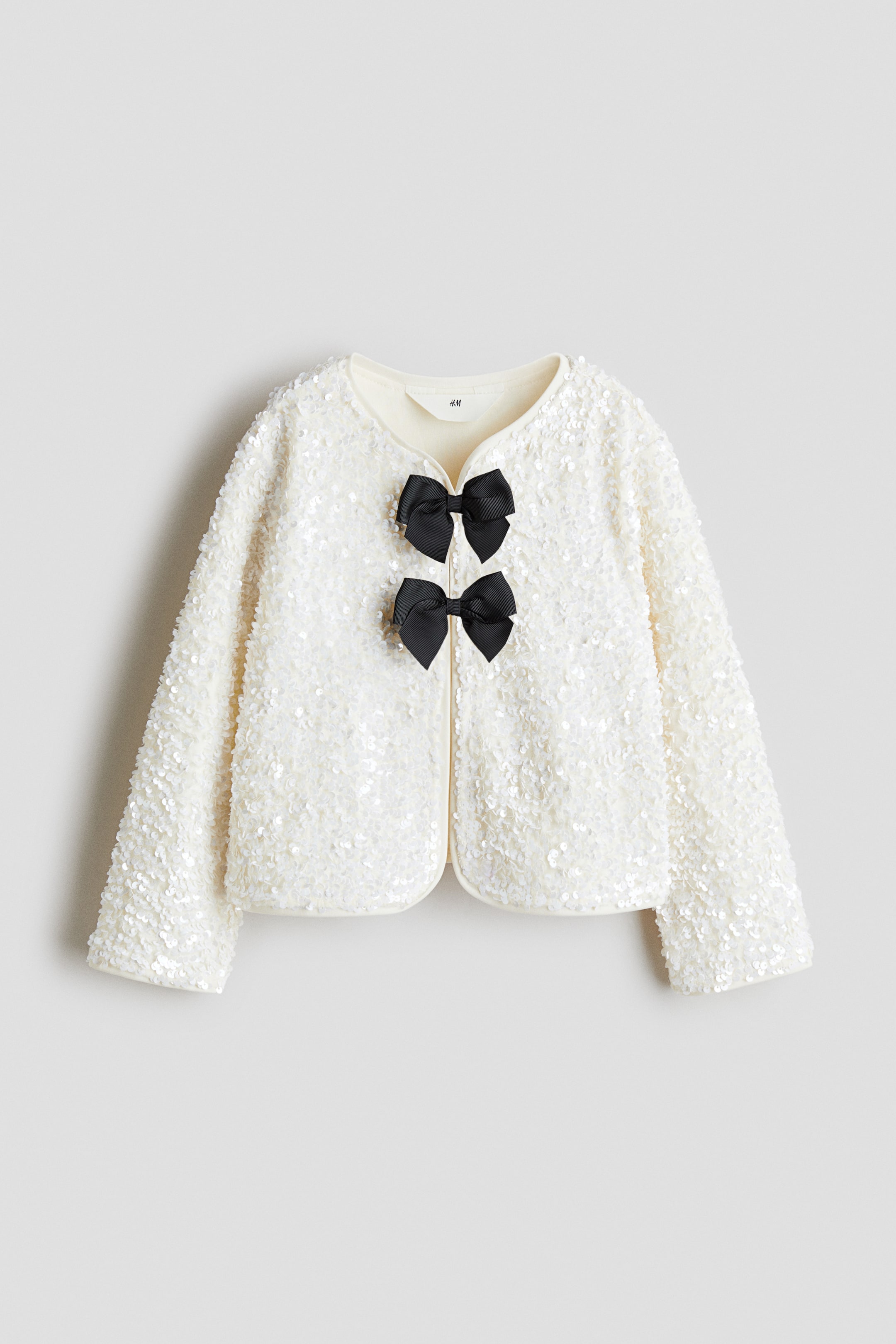 Ampliar la imagen: Saco de lentejuelas con moños - Blanco - Kids | H&M MX 1