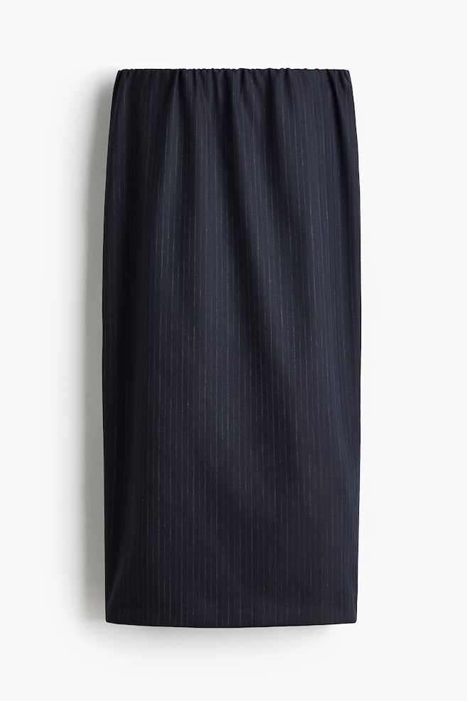 A calf-length dark pinstripe skirt in woven fabric is being presented from the front, featuring an elasticated waist and a straight-cut hem. - 1