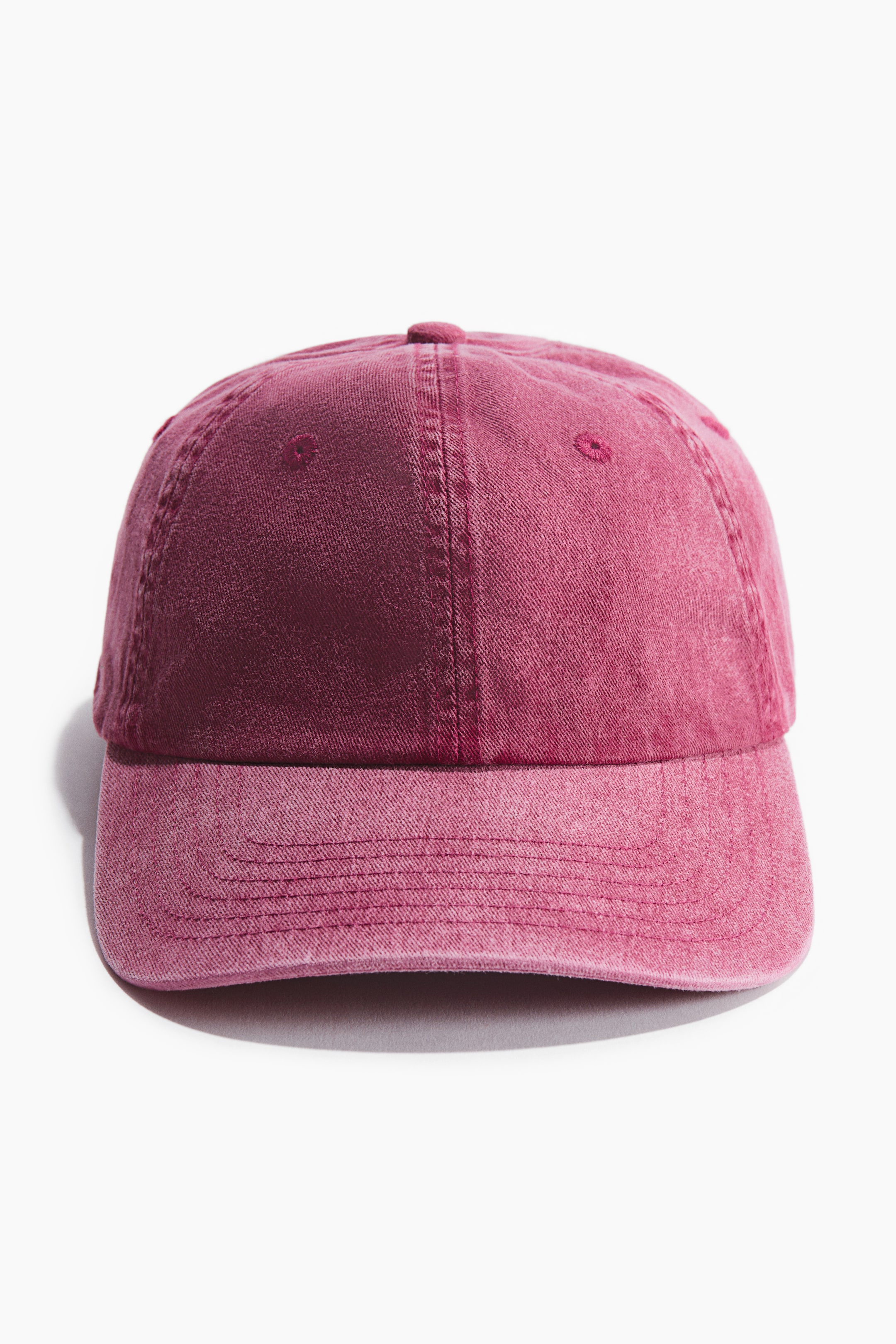 View larger image: Front view of a cap crafted from burgundy cotton twill, showcasing a curved brim with multiple stitching lines and a paneled crown with eyelets.