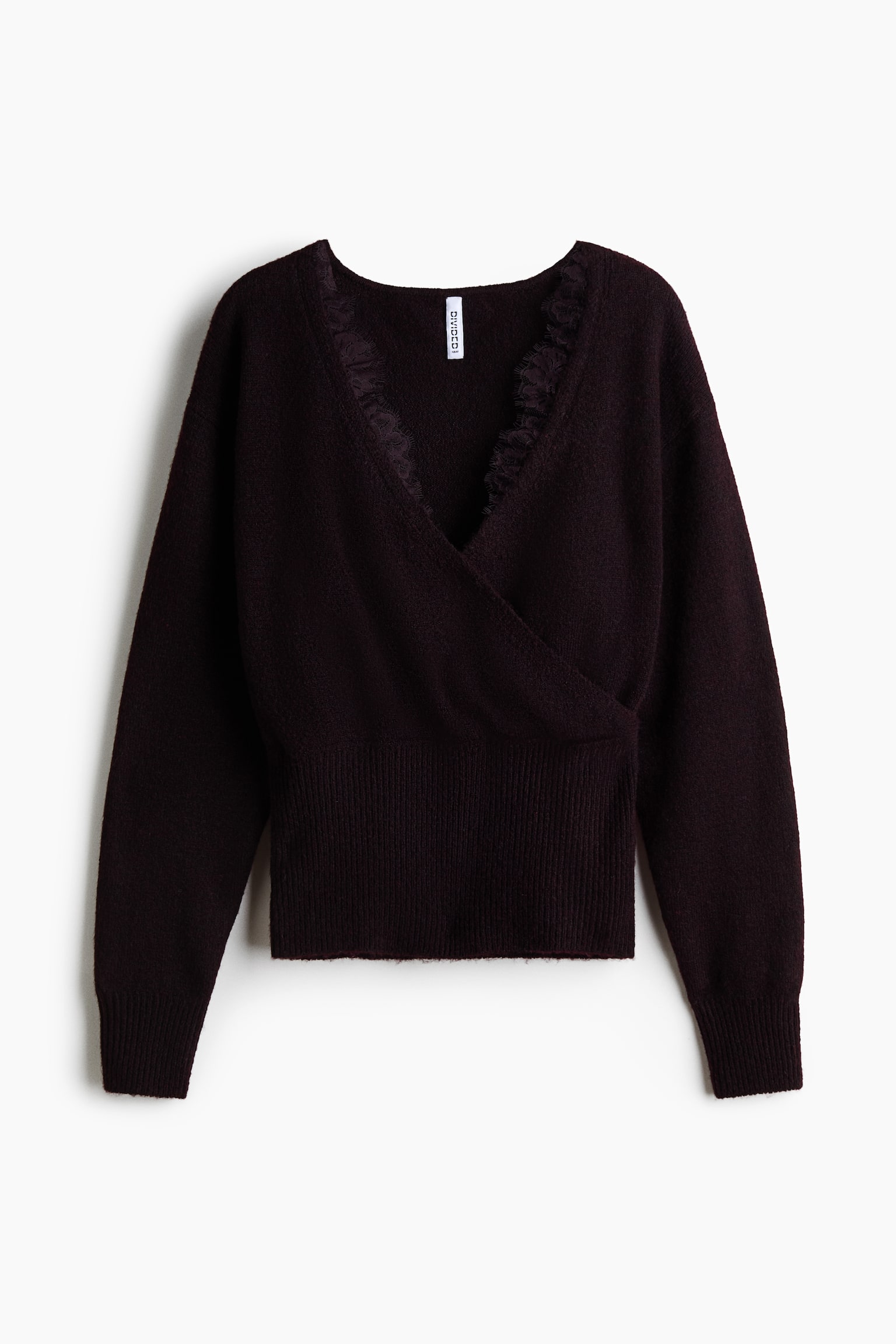 A dark plum knitted jumper is shown from the front, featuring a wrap-style design with a deep V-neckline detailed with delicate lace trim. The jumper has a soft texture, long sleeves with ribbed cuffs, and a wide ribbed waistband. - 1