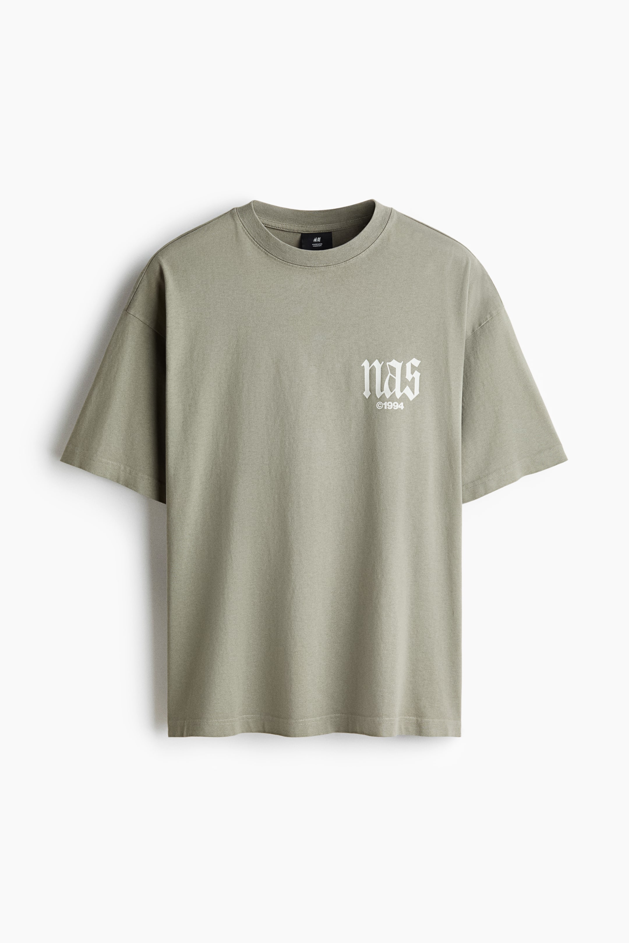 View larger image: An olive green oversized T-shirt is facing forward, showcasing a white 'nas' print with '©1994' underneath on its chest. It features a rib-trimmed crew neckline, dropped shoulders, and a straight-cut hem, creating a baggy, extra-loose silhouette.