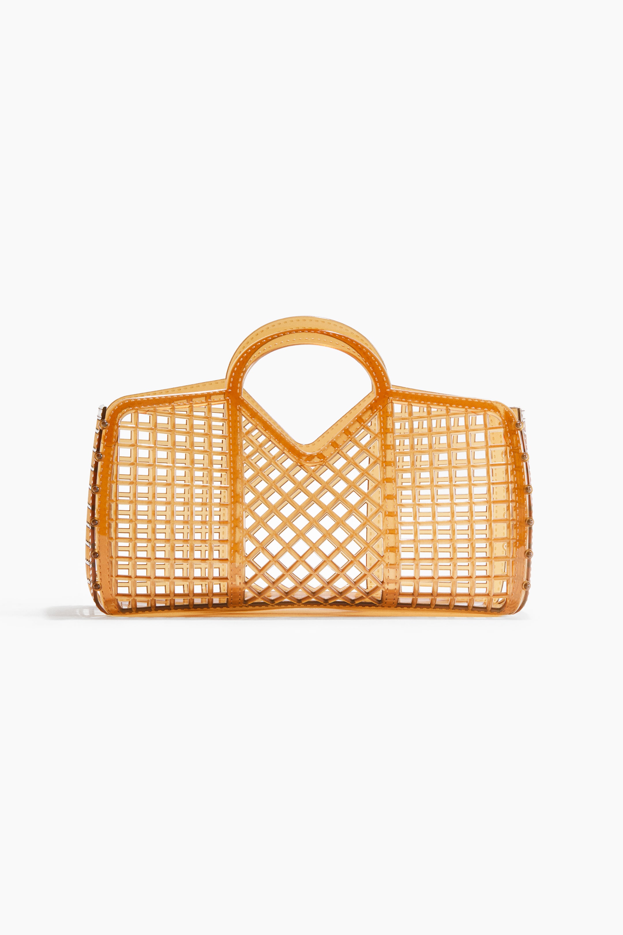 View larger image: A translucent amber tote bag is facing front, showcasing a grid pattern with square and rectangular openings throughout its body and two integrated top handles forming a V-shape.