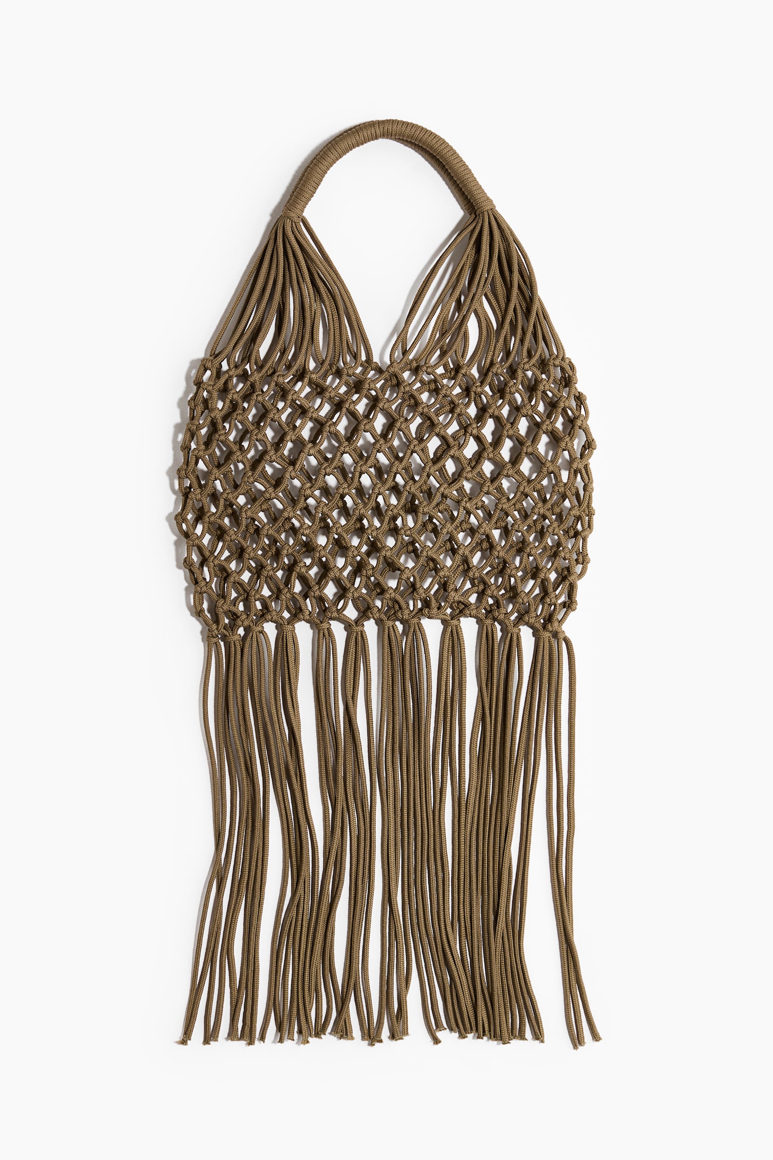 A khaki macramé bag is facing front, featuring an open net body. It is displaying a rounded handle at the top, and long, matching fringe is hanging from its bottom edge. - 1
