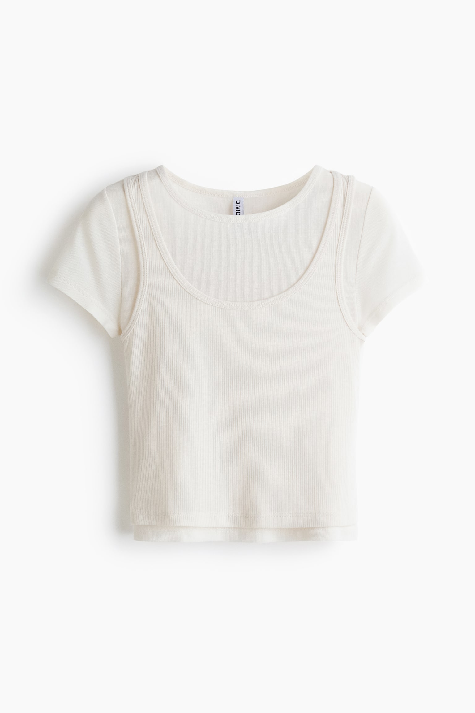 An off-white, front-facing short-sleeved top features a ribbed main body with a deep scoop neckline. Smooth short sleeves emerge from the shoulders, creating a layered visual effect with the ribbed section. The top is designed with a cropped length, perfect for a chic and modern look.