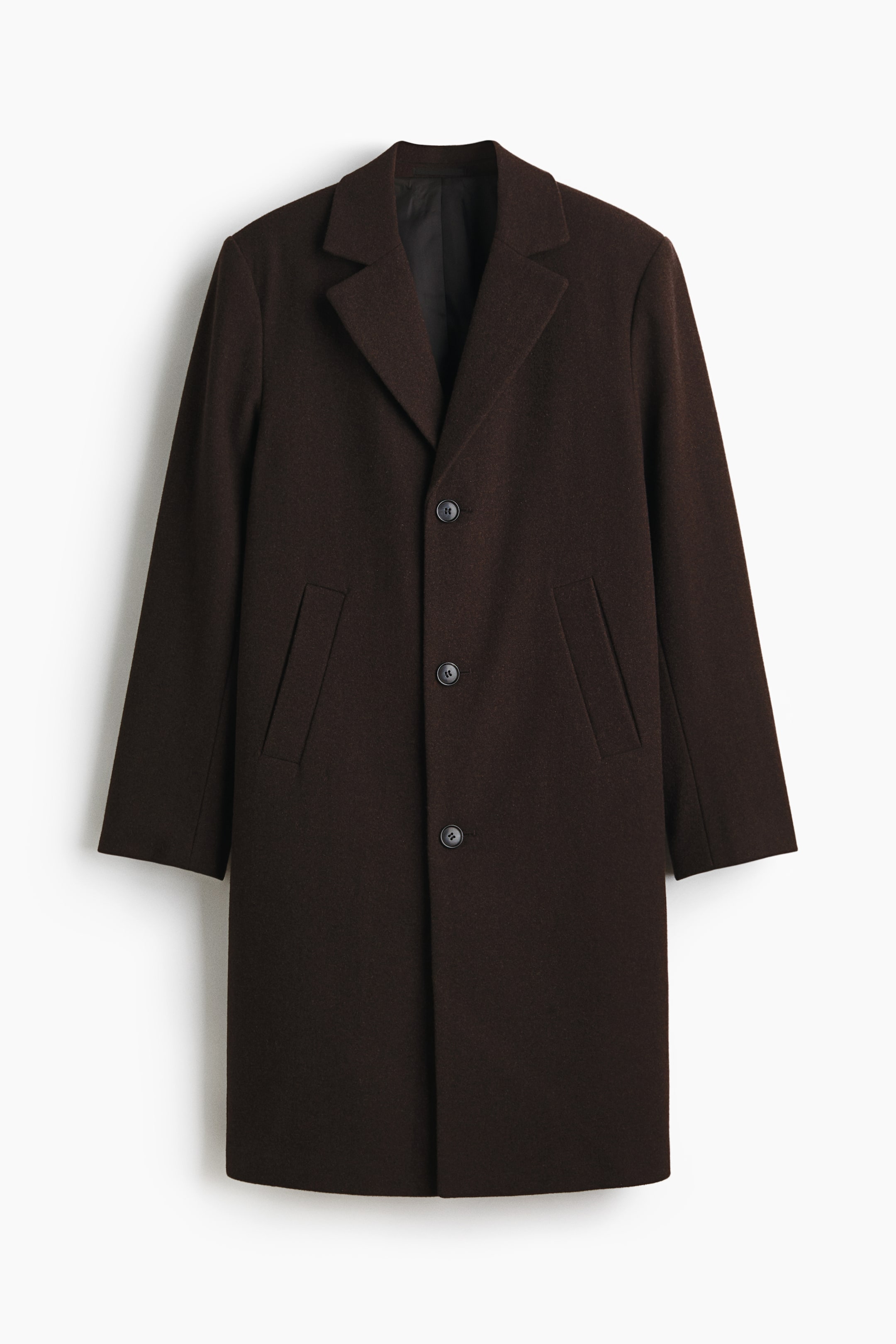 View larger image: A dark brown coat is presenting its FRONT, featuring notch lapels and a three-button front closure with matching dark buttons. Two flap pockets are visible at the hip, and a black lining is showing under the lapels.