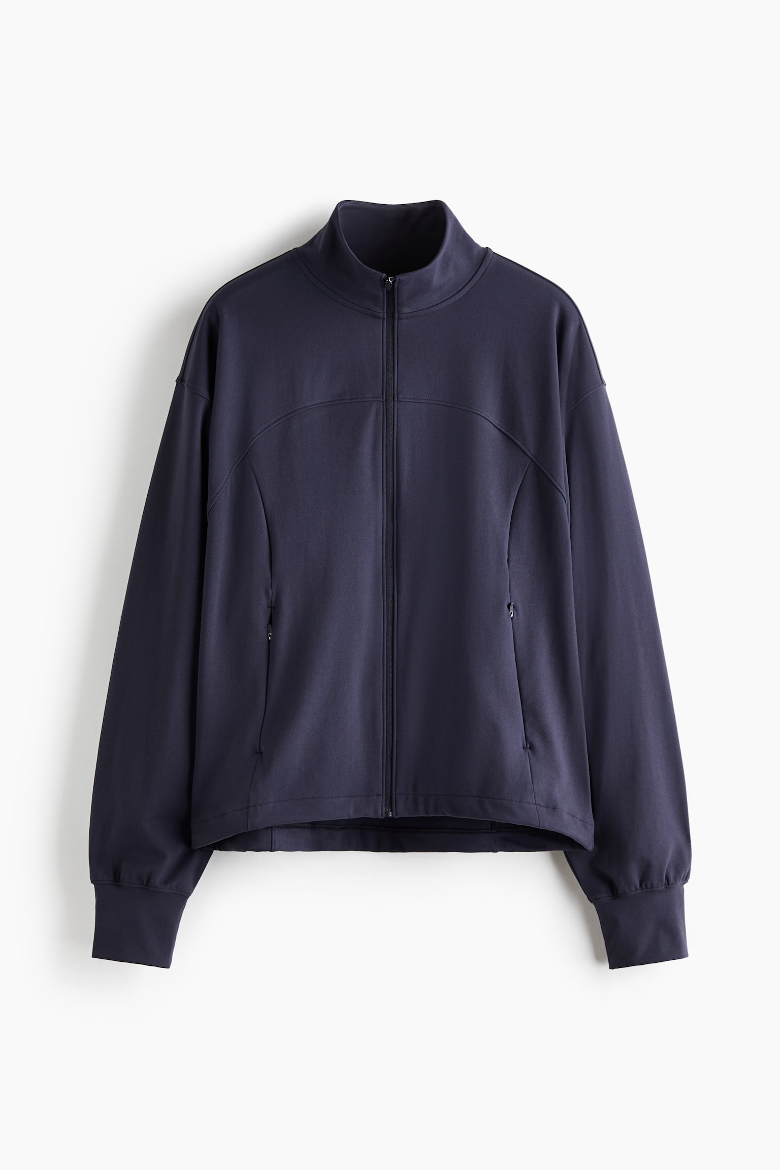 A dark navy blue athletic jacket is hanging in a front-facing view, featuring a high stand-up collar, a full-length front zipper, and curved yoke seams across the chest. The jacket is displaying dropped shoulders, side zipper pockets, and long sleeves with wide, fitted cuffs. - 1