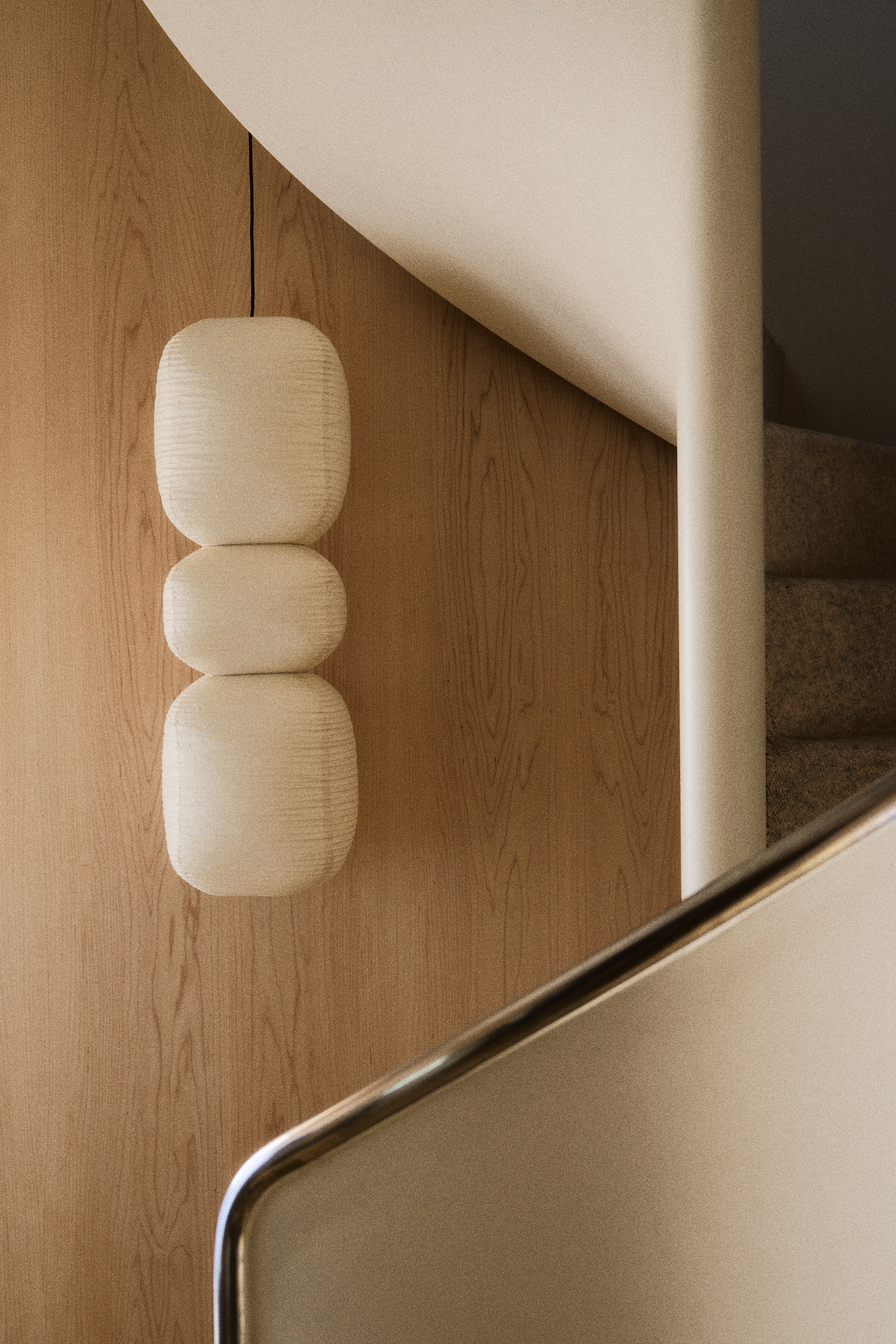 View larger image: An off-white pendant lamp hangs from a black cord, featuring three stacked, rounded, pill-shaped segments. Each segment displays a subtle ribbed texture.