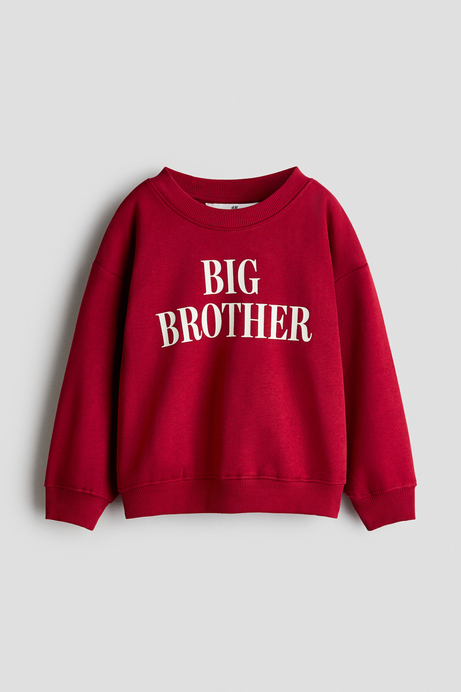 ä¸ä»¶ç´è²å¯¬é¬çåæ¯è¡£æ­£é¢å±ç¤ºï¼è¸åå°æç½è²ãBIG BROTHERãå­æ¨£ãéä»¶æè£æ¡ç¨åé ç¾ç´é£¾éè¨­è¨ï¼è½è©åªè£ï¼è¢å£åä¸æºåé£¾æç¾ç´ç´°ç¯ã