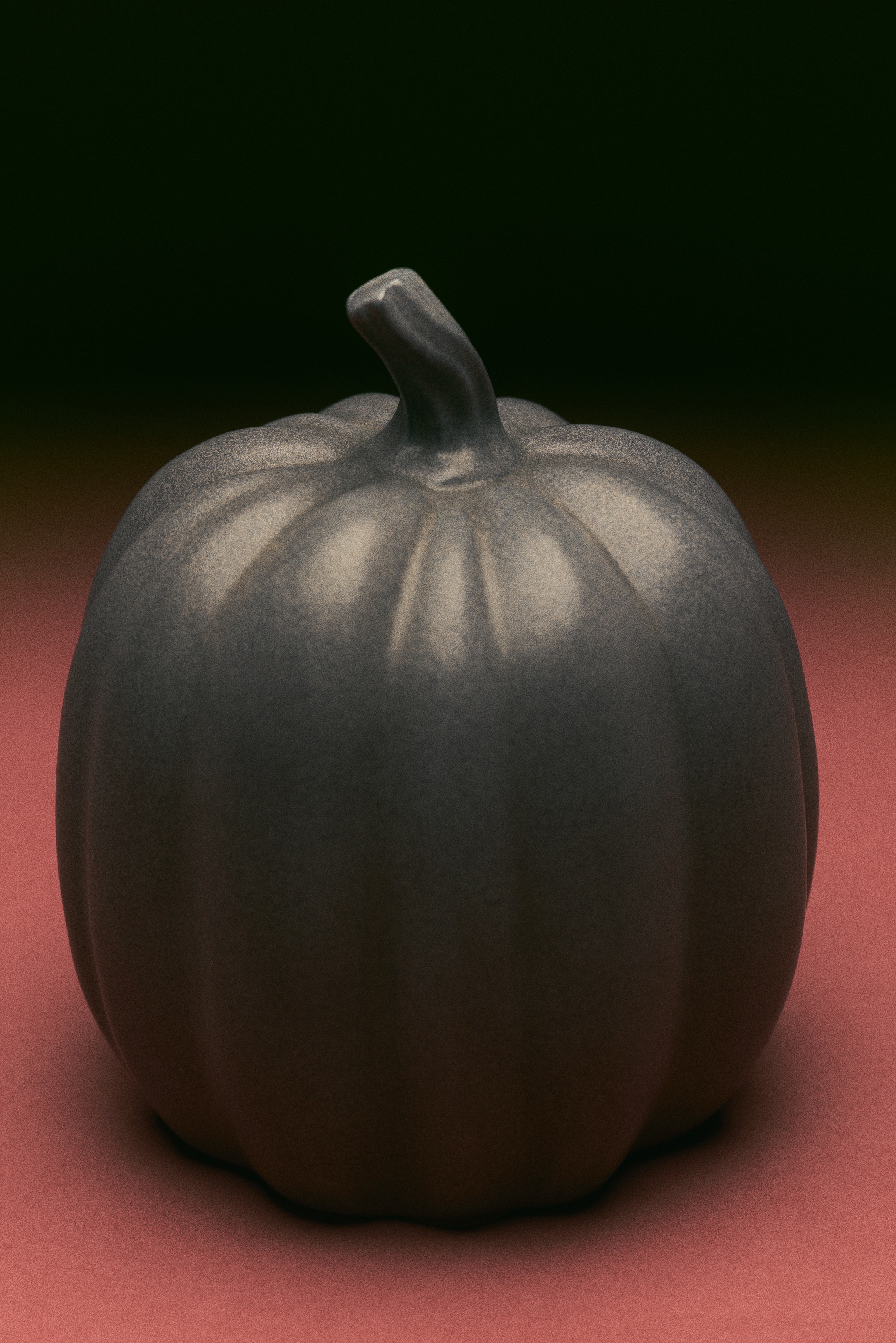 A dark grey decorative pumpkin faces forward and slightly to the right, showcasing a textured surface with prominent vertical ridges. A short, curved stem emerges from its top.
