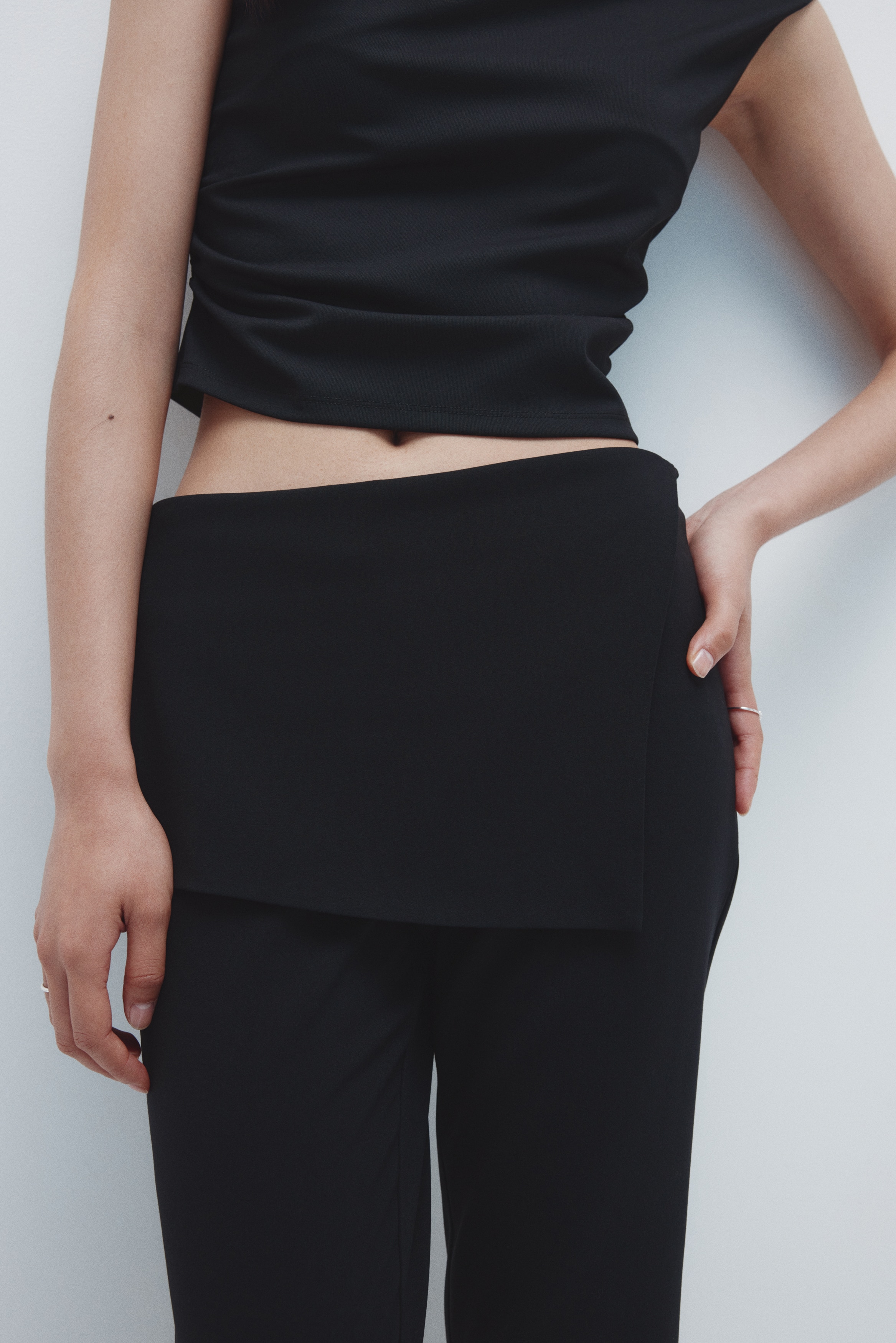 Skirt-layered trousers