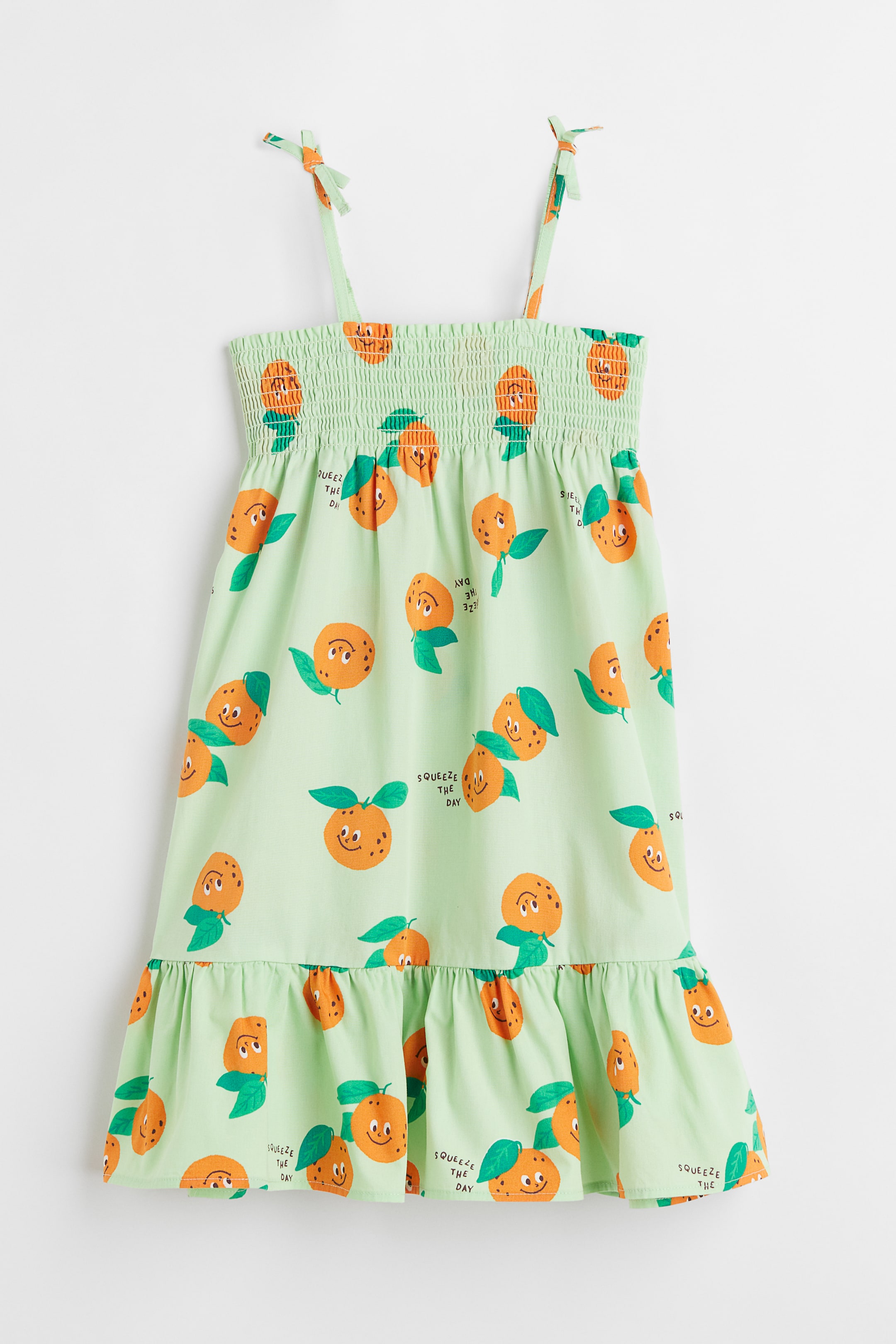 Light green/Oranges Smocked cotton dress for kids | H&M Light green/Oranges Smocked cotton dress for kids | H&M