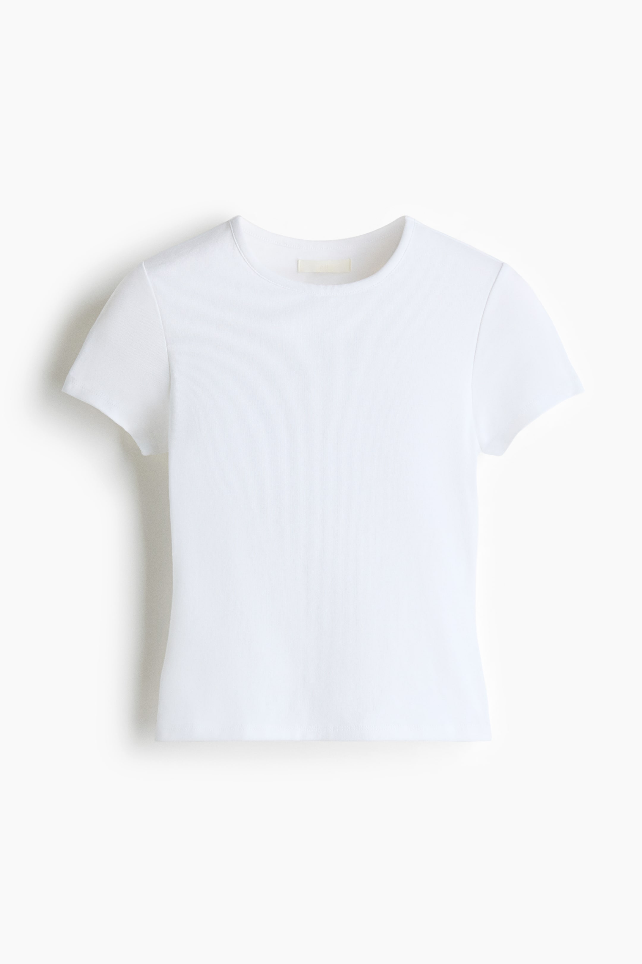 View larger image: White fitted T-shirt shown from the front, featuring a round neckline, short sleeves and a straight-cut hem in jersey fabric.