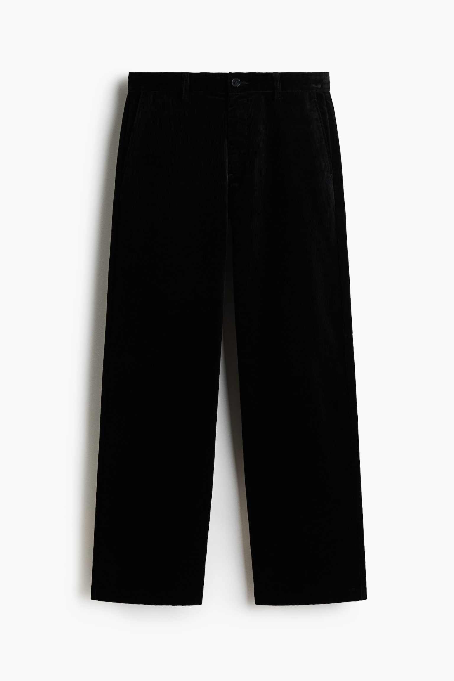 Black corduroy trousers are displayed front-facing. They feature a waistband with belt loops, a single button closure, and angled side pockets. The trousers are designed with a wide-leg fit. - 1
