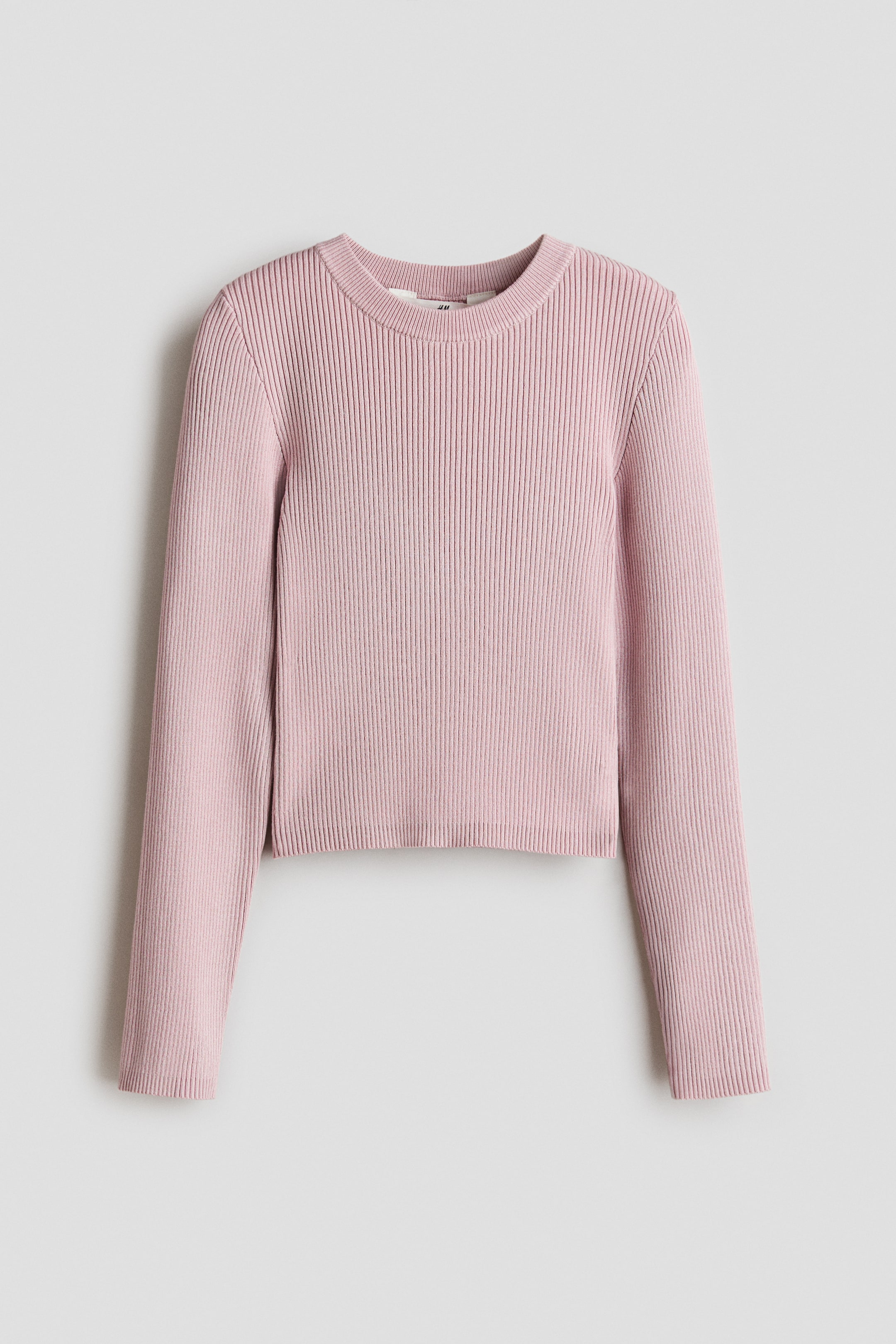 View larger image: A pink ribbed knit jumper showcases a front-facing design, featuring a crew neck, long sleeves, and a cropped length with a straight hem.