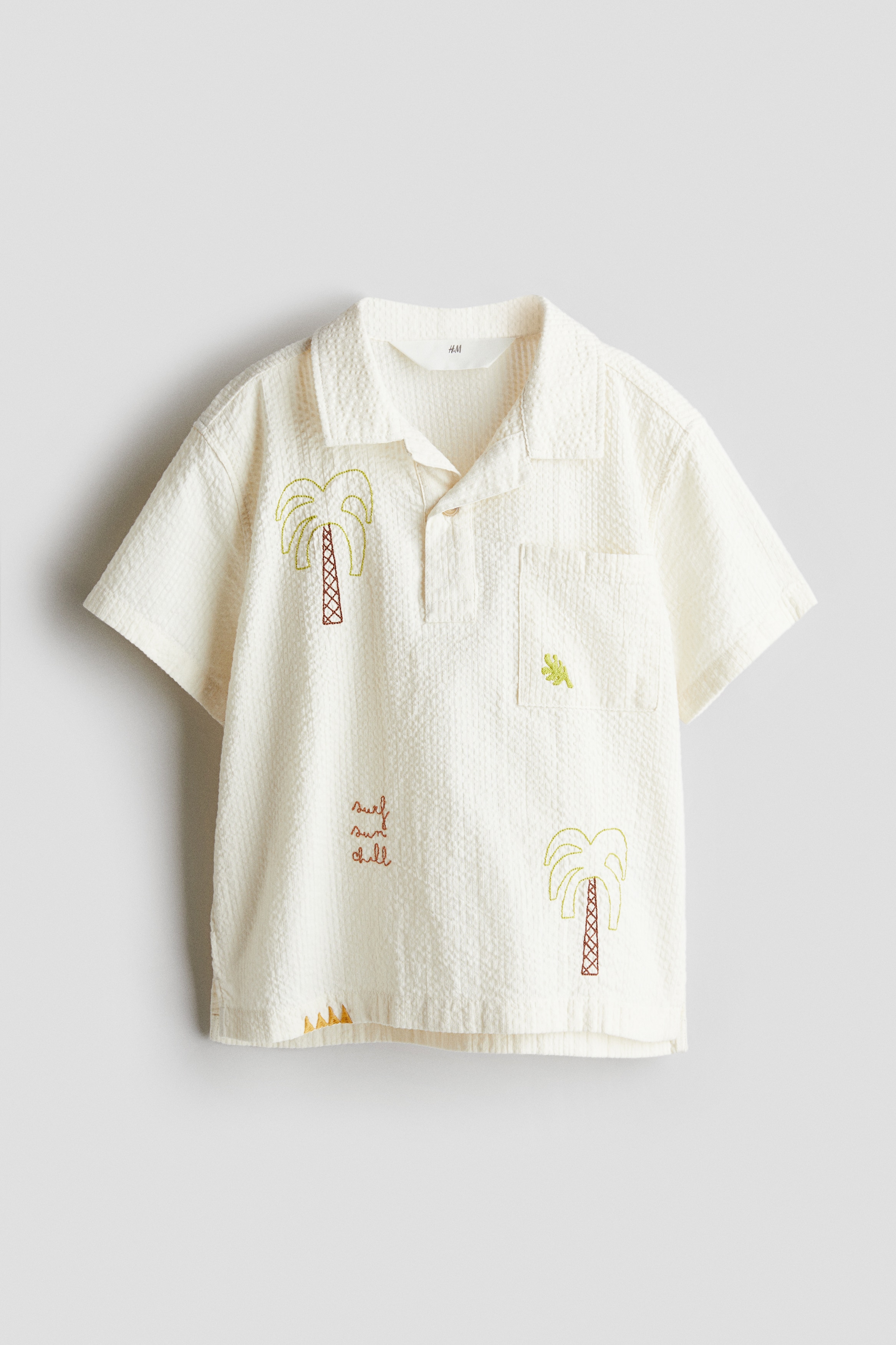 Poloshirt van katoenen seersucker - Roomwit/palmbomen