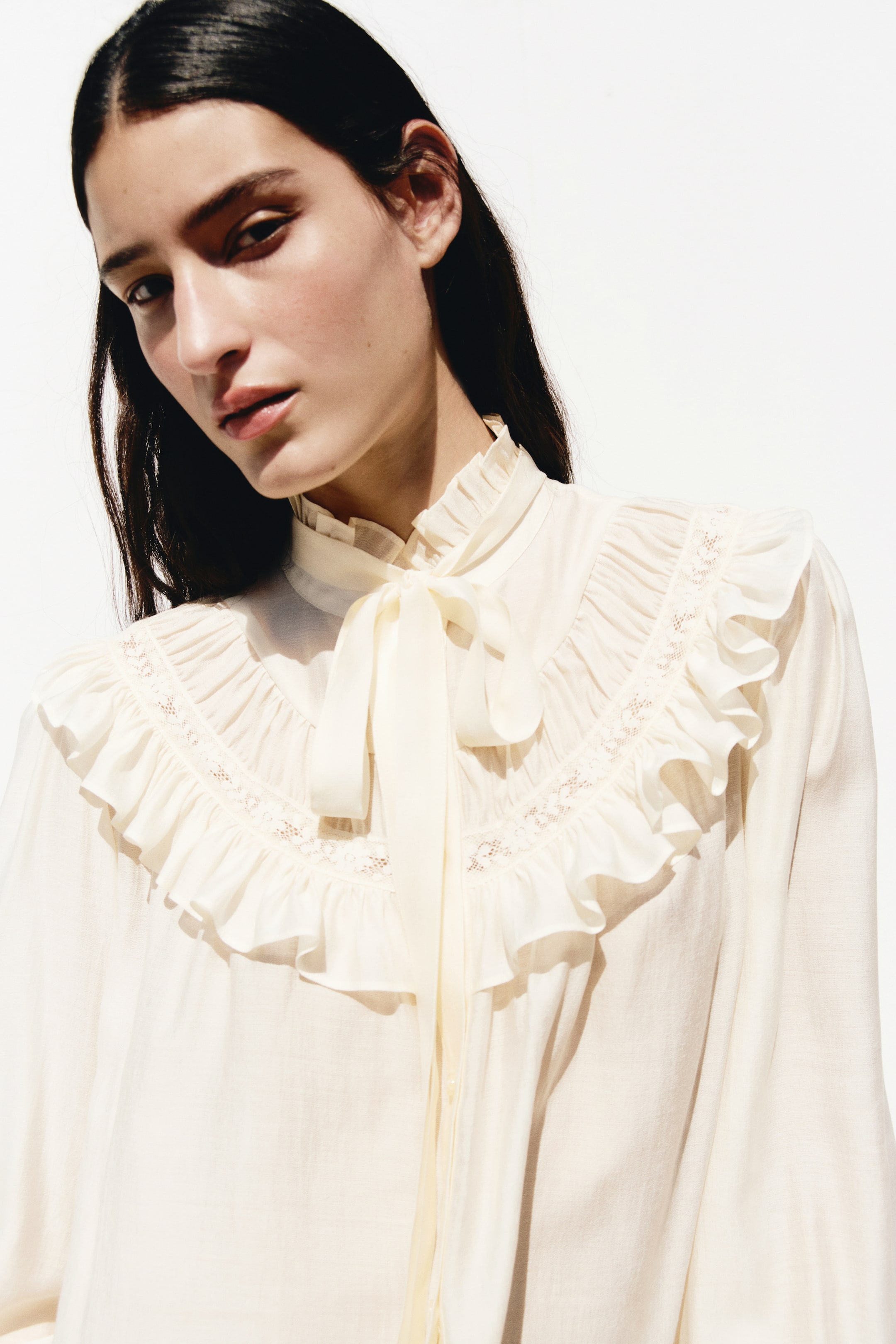 Ruffle-Trimmed Tie-Neck Blouse