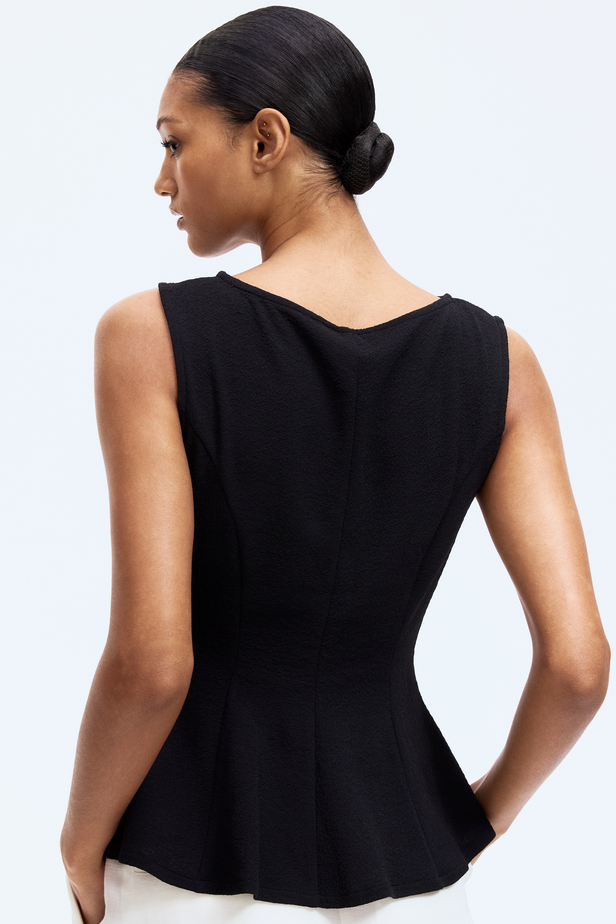 Sleeveless peplum top