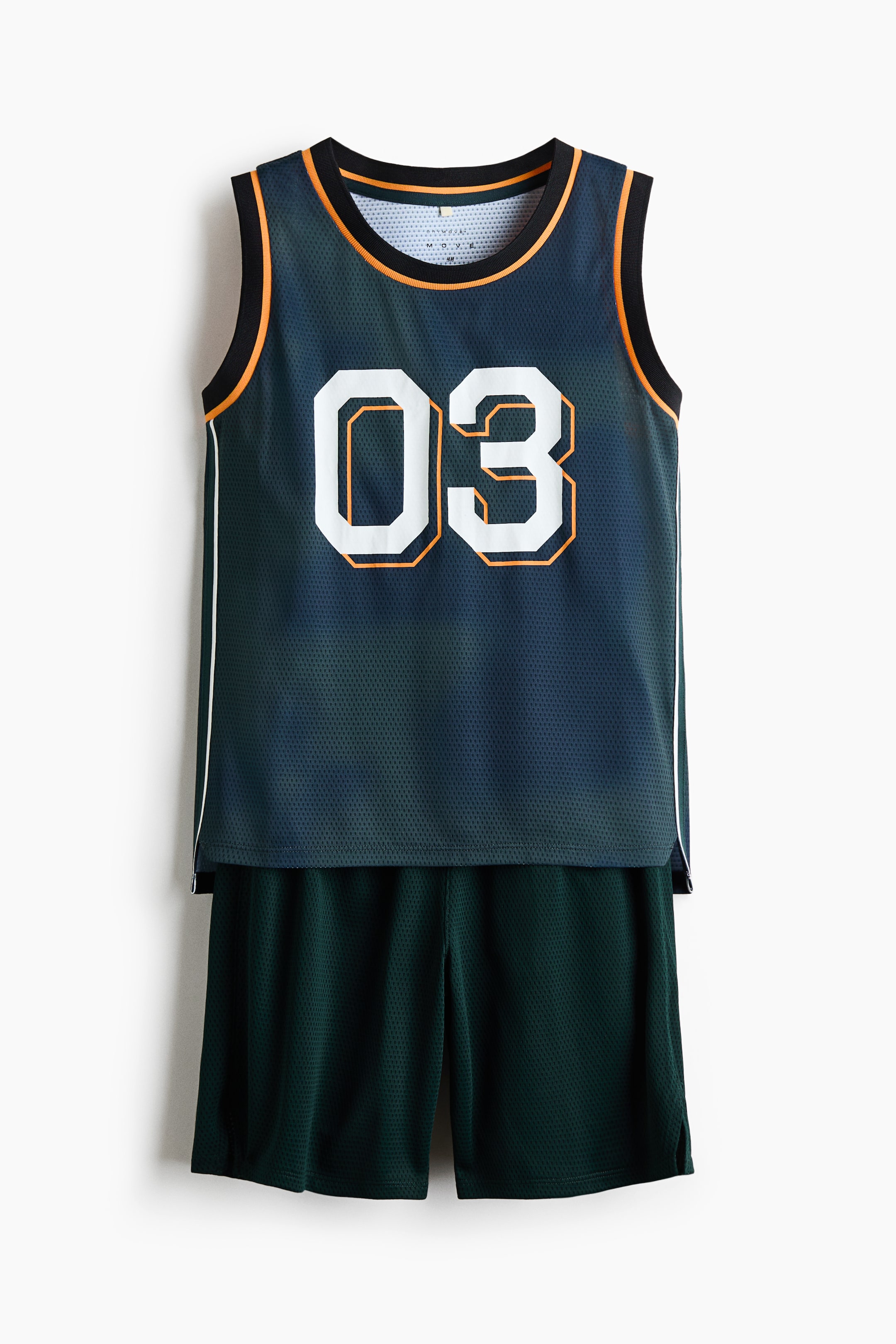 View larger image: A dark teal mesh basketball jersey and matching dark green mesh shorts are presented as a coordinated athletic set. The jersey features black and orange ribbed trim at the neckline and armholes, with large white numbers '03' outlined in orange on the front, and white piping running down the sides.