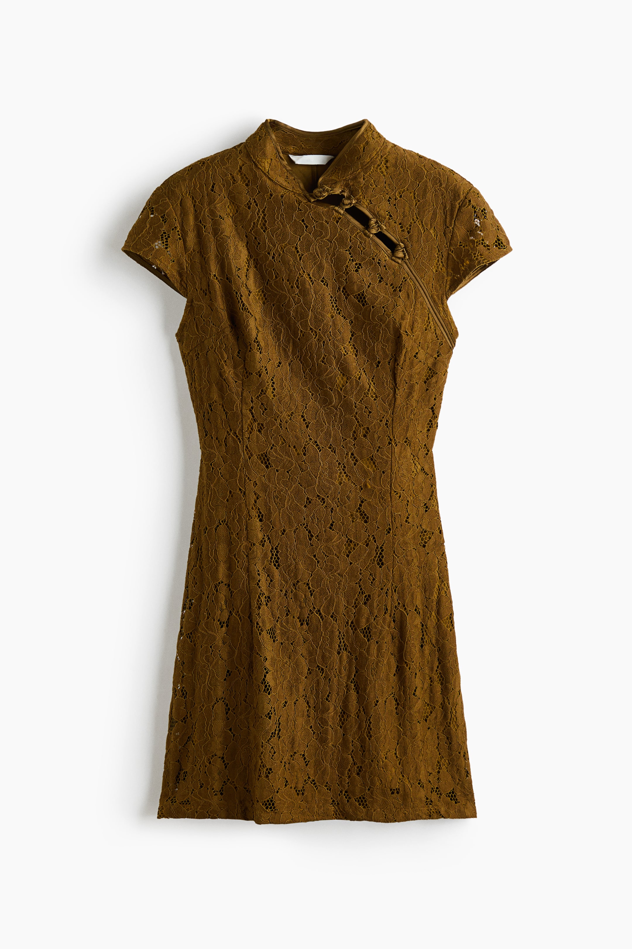 View larger image: A short, fitted olive-brown lace dress is facing front, showcasing a band collar and a diagonal opening with knot buttons across one side of the chest. The dress features short cap sleeves and vertical waist darts that structure its fitted silhouette.