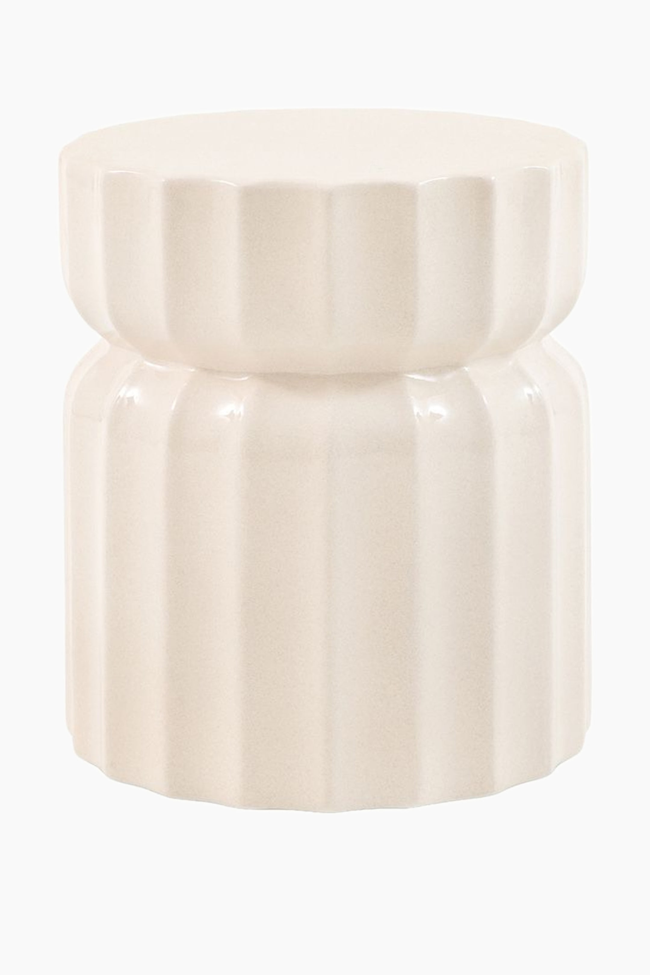 View larger image: An off-white glazed ceramic stool features a round top surface. Its cylindrical body displays vertical fluting and forms two distinct sections, with a gentle indentation around the middle.