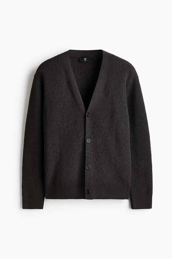 A dark brown ribbed knit cardigan is facing straight on, featuring a V-neckline, a four-button front closure with dark buttons, ribbed cuffs, and a ribbed hem. - 1