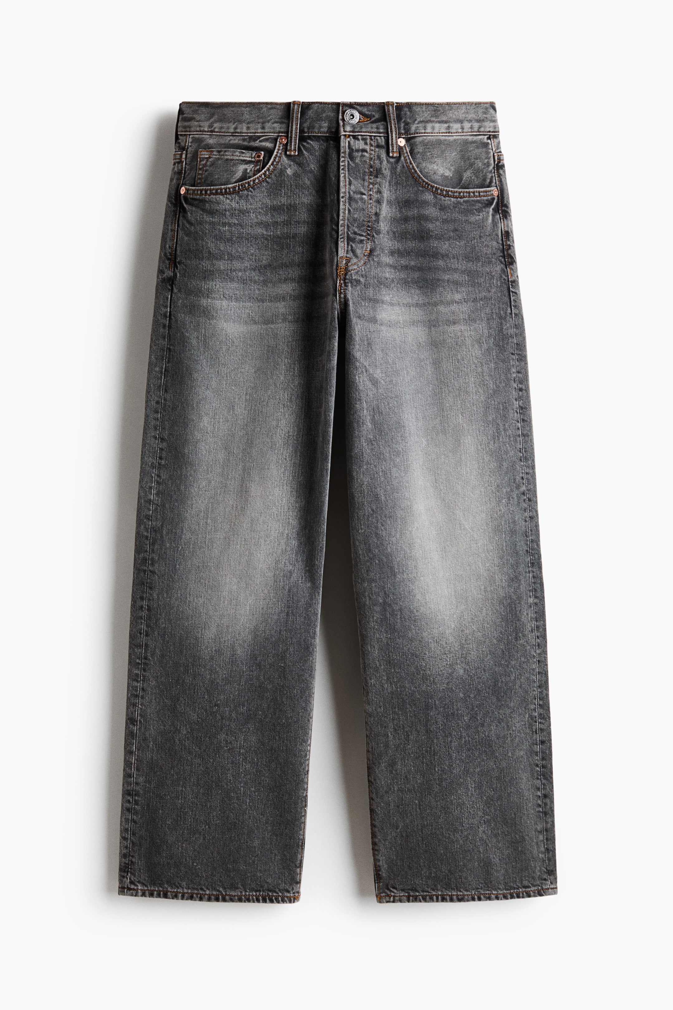 View larger image: Jeans exhibit a dark grey faded wash with lighter patches on the thighs and knees, shown from the front, and featuring a wide-leg fit, a button fly fastening, and visible contrast stitching around the seams and pockets.