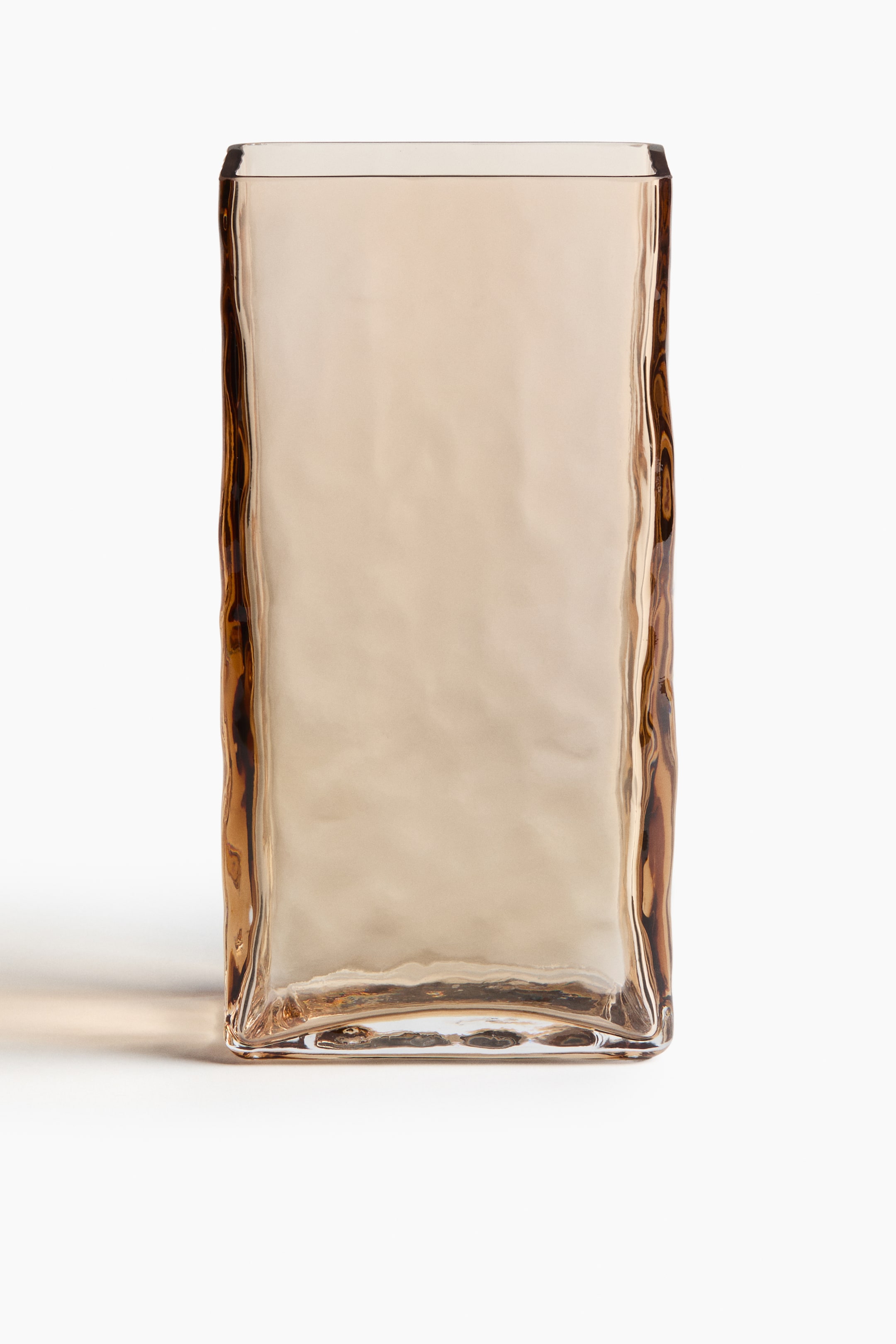 View larger image: An amber rectangular glass vase is presented FRONT, featuring a tall, upright form. Its broad faces are displaying a subtle, organic undulation, while its vertical edges are exhibiting a pronounced, molten-like rippled texture.